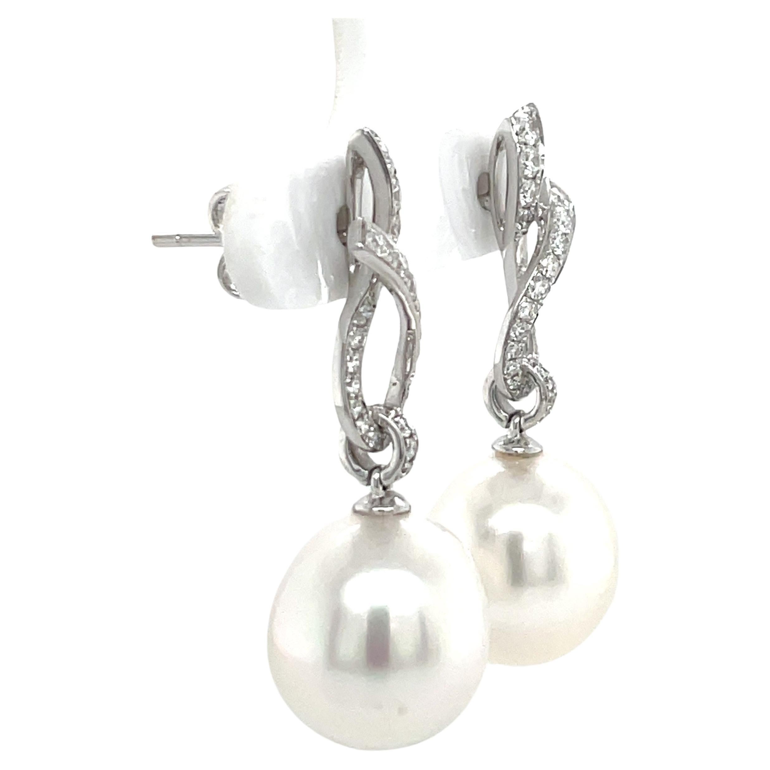 18 Karat White Gold Diamond Ribbon South Sea Pearl Earrings .057 Carats In New Condition For Sale In New York, NY