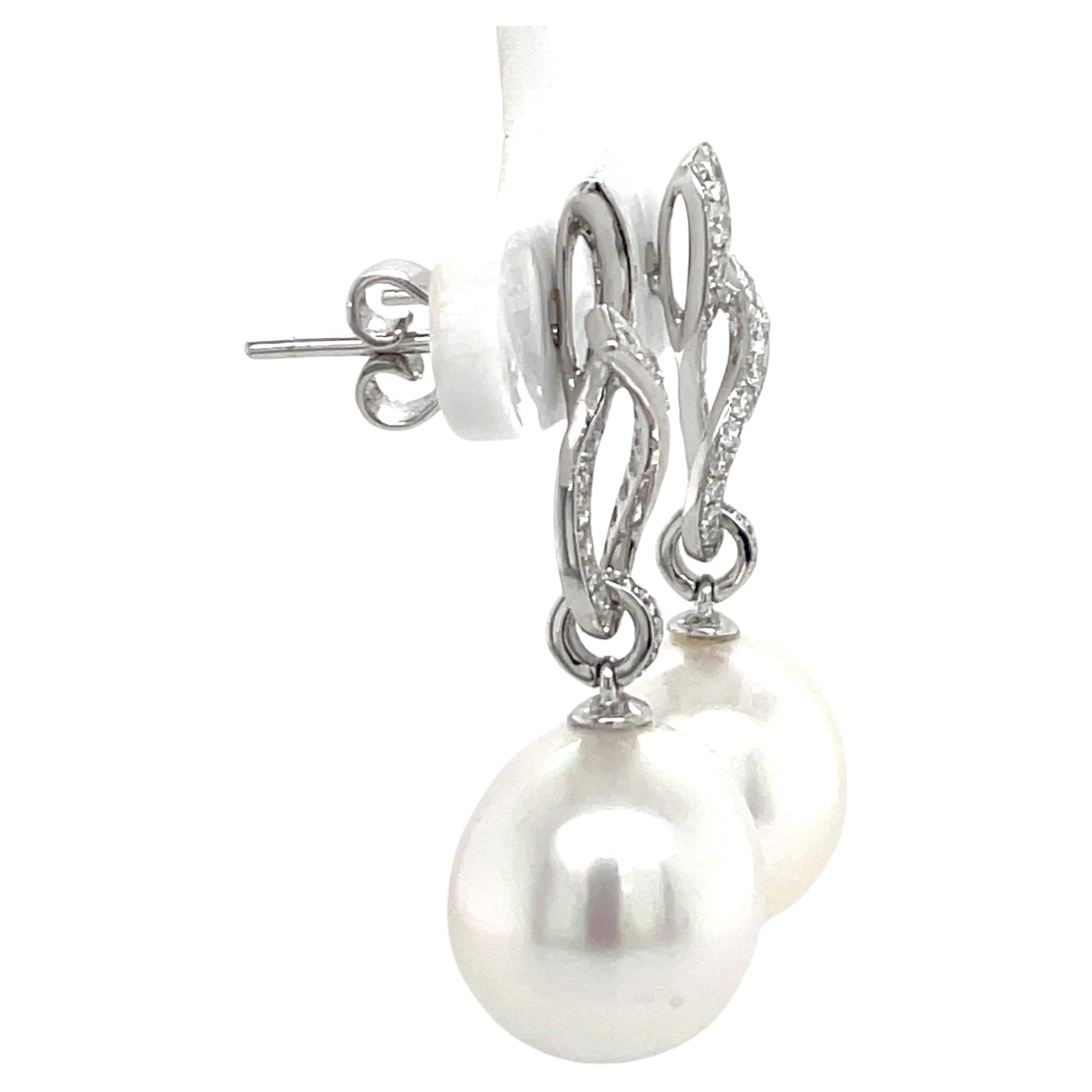 Women's 18 Karat White Gold Diamond Ribbon South Sea Pearl Earrings .057 Carats For Sale