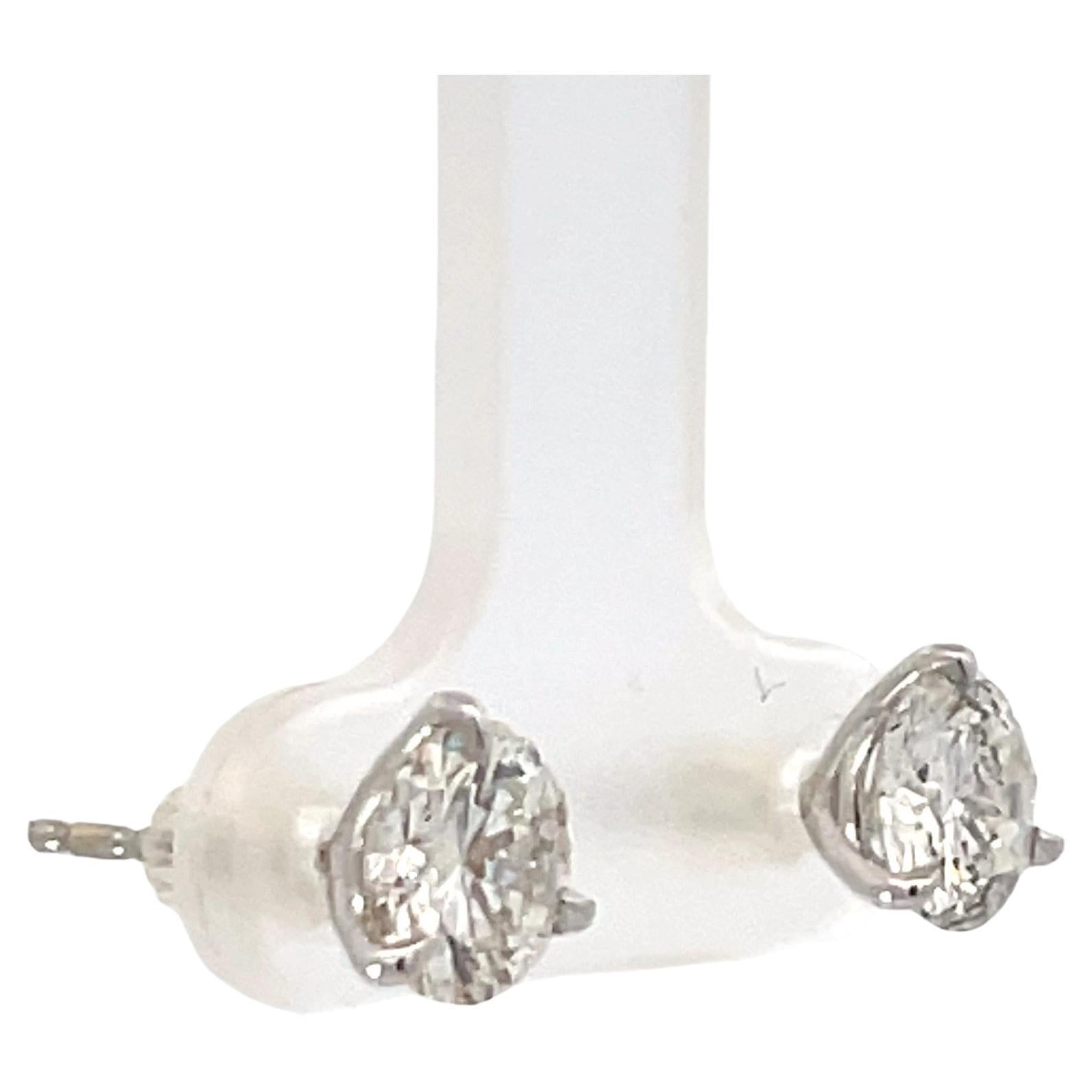 Diamond stud earrings weighing 2.09 Carats, Color H, Clarity I1, in 18 Karat White Gold 3 prong Champagne setting. 
Nice Life & Clean to the Eye
Setting can be changed to a Basket, Martini or Champagne/ 3 or 4 Prong/ 14 or 18 Karat.

DM for more