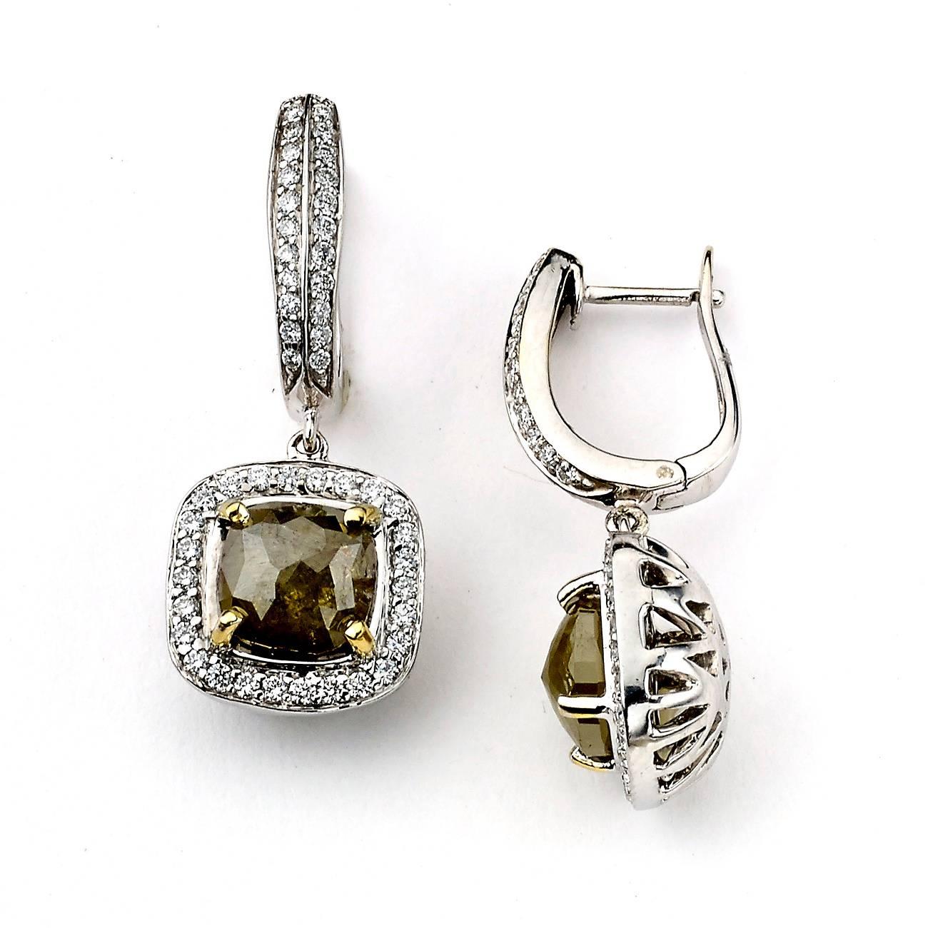 This Beautiful Earring is crafted by 18K White Gold centered by two Rough Diamonds with Yellow Gold Accent:

Diamond weight: 0.74
Diamond Color: G-H
Diamond Clarity: SI1-SI2
Setting: Prong

Diamond Cut: Cushion
Diamond Count:2
Diamond