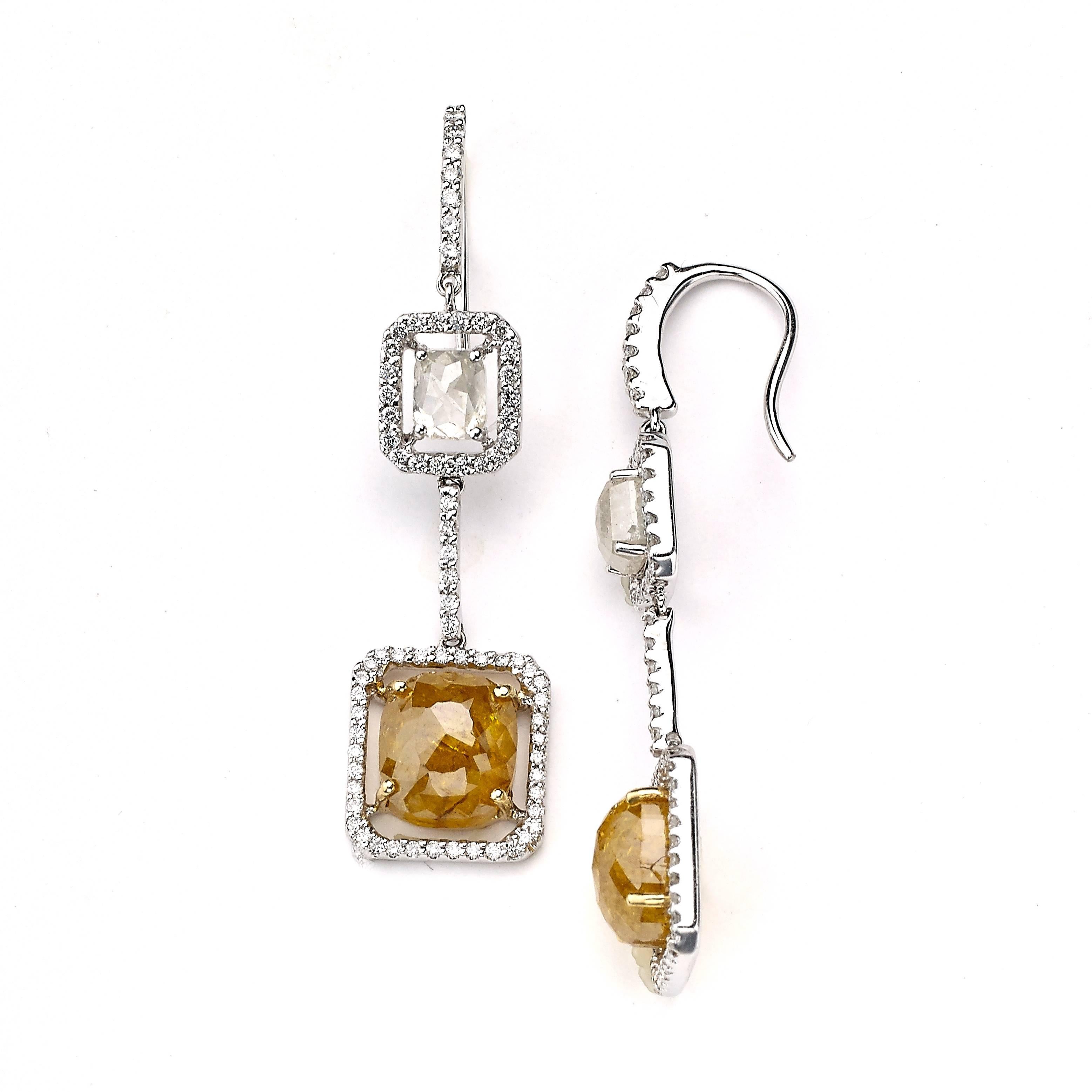 These Earrings feature Fancy Grey Diamonds and Yellow Diamonds surrounded by White Pave Diamonds.

Two Cushion Yellow Diamonds for a Total Weight of 8.00 Cts.
Clarity: I2-I3
Setting: Prong

Two Grey Diamonds: 1.7/8 cts
Clarity; I2-I3

White