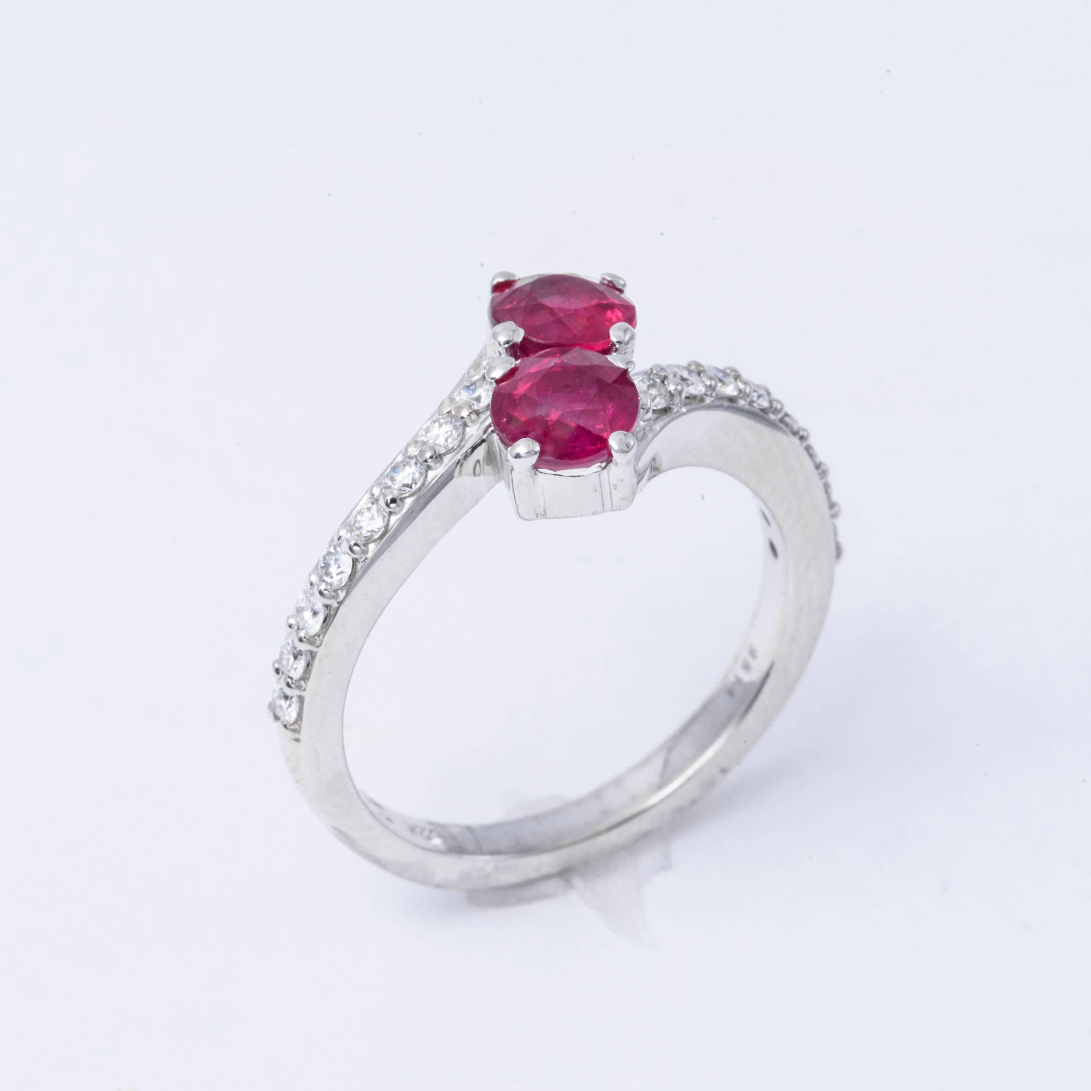 14 K White Gold Ring featuring 2 Ruby's for a total weight of  1.59 Cts.
The Diamonds weight is 0.34 cts. Color : G Clarity: Si1-+Si2
One of a kind ring, very well made 
The diamonds are perfectly matched