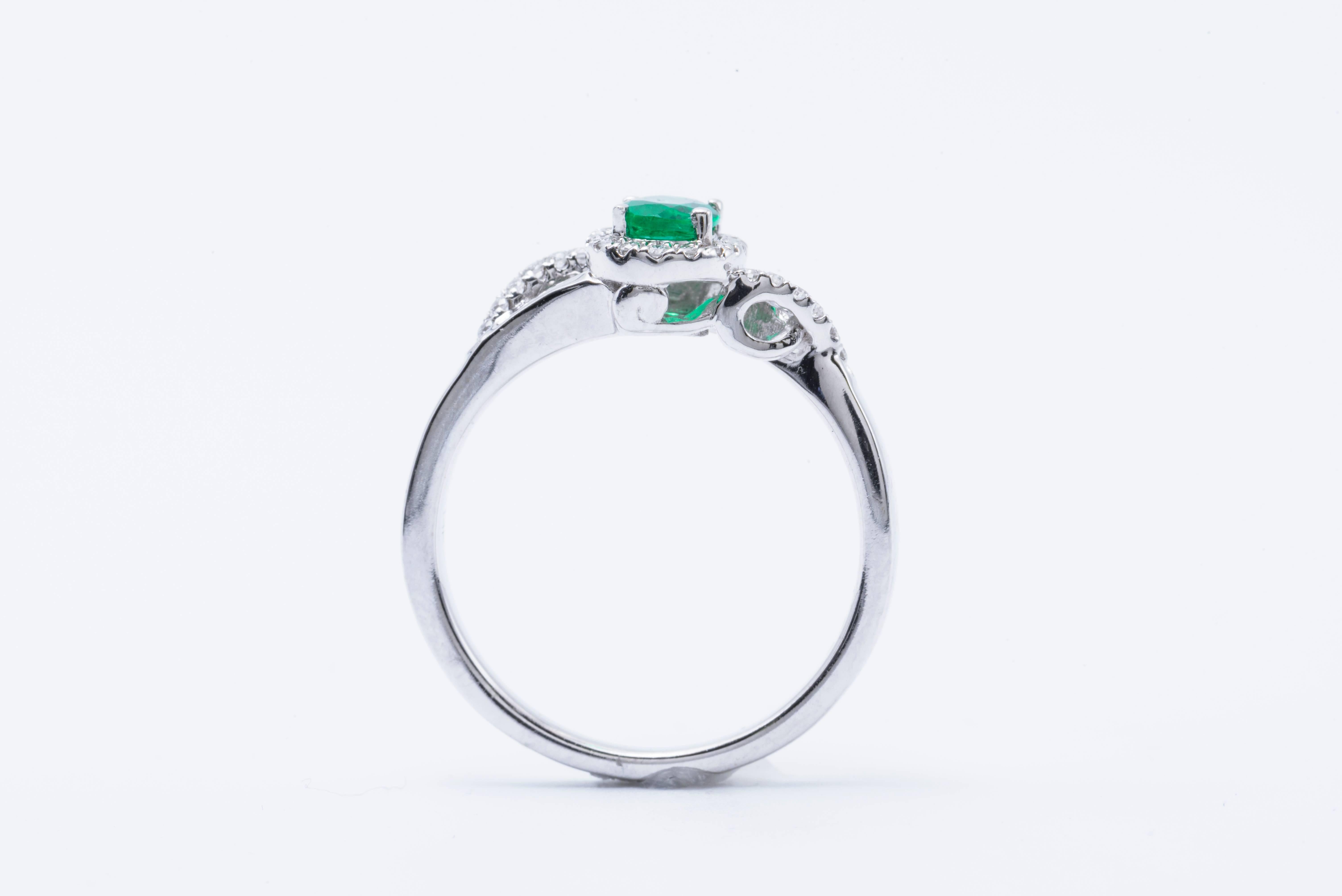 Women's Emerald and Diamond Halo Engagement Ring