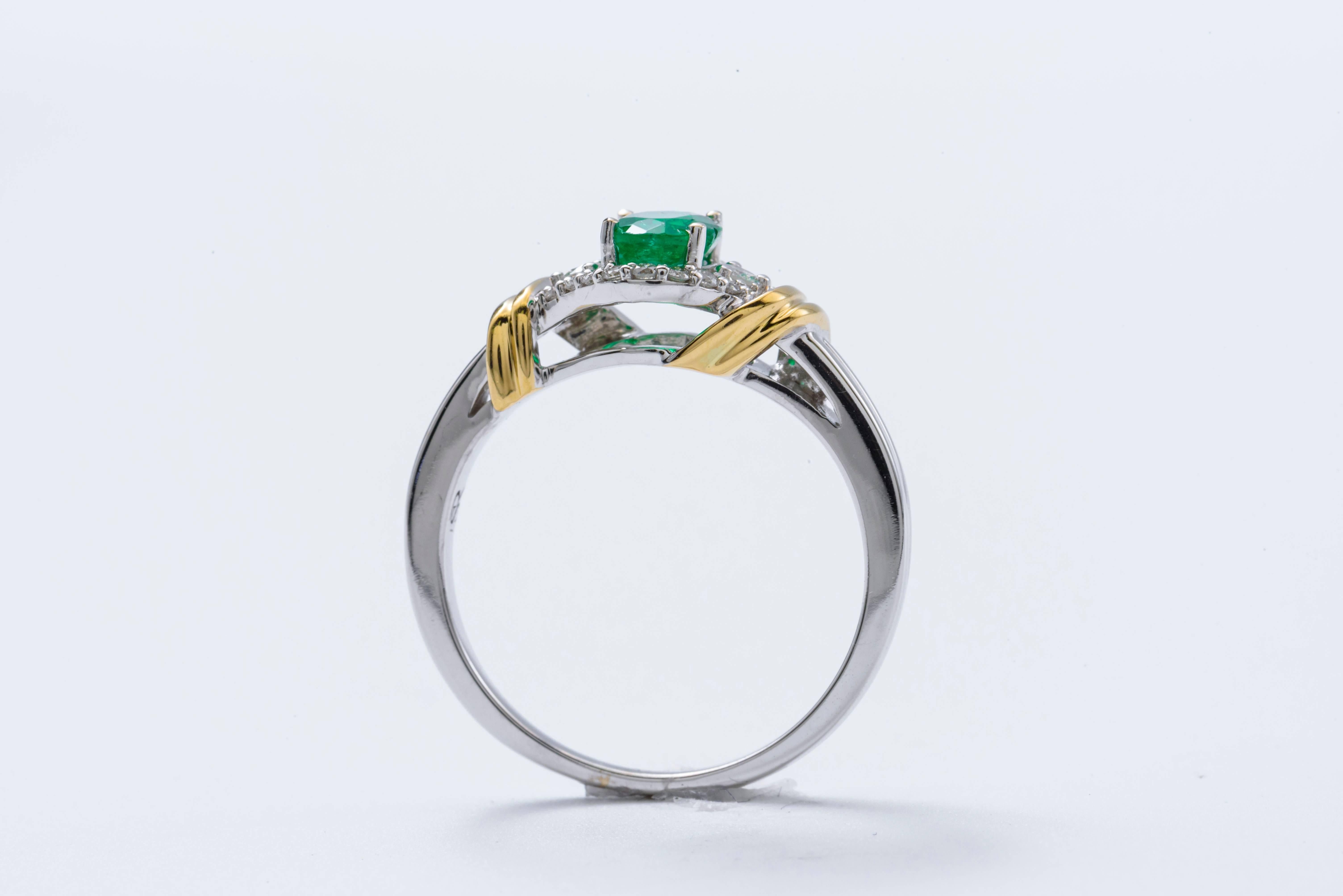 Contemporary Two-Tone Oval Shape Emerald and Diamond Halo Ring