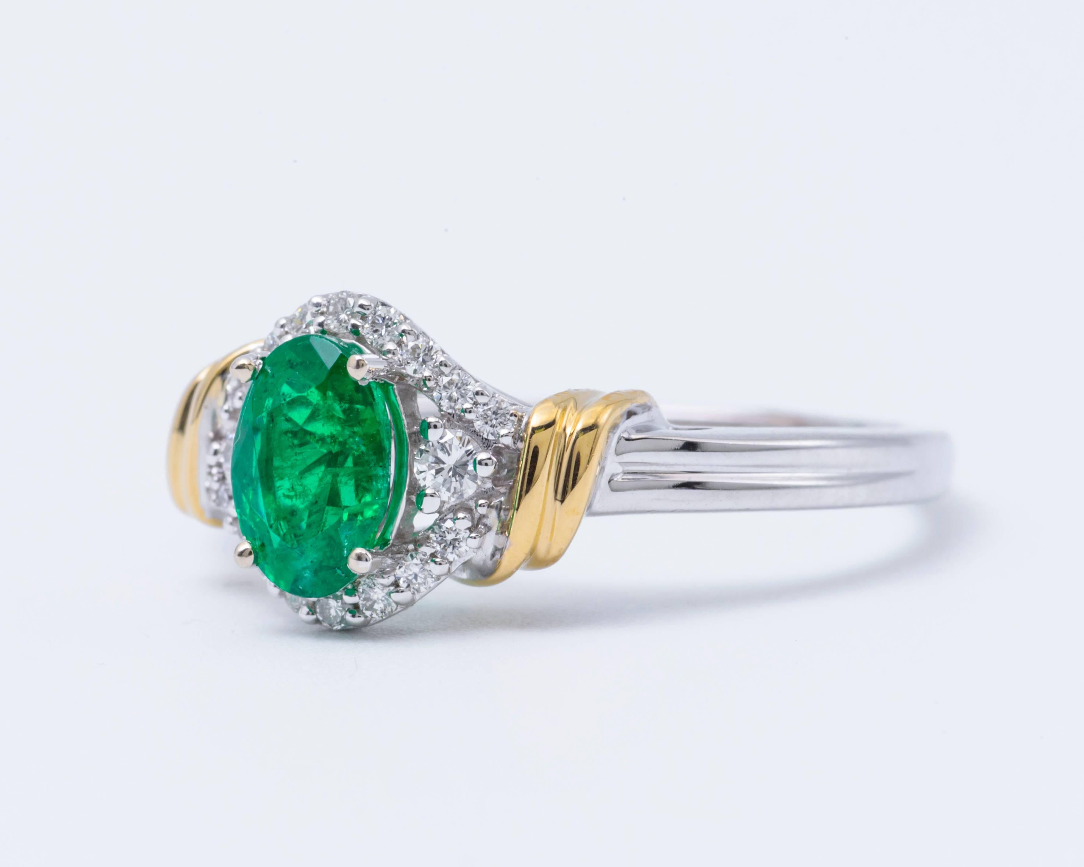 Women's Two-Tone Oval Shape Emerald and Diamond Halo Ring