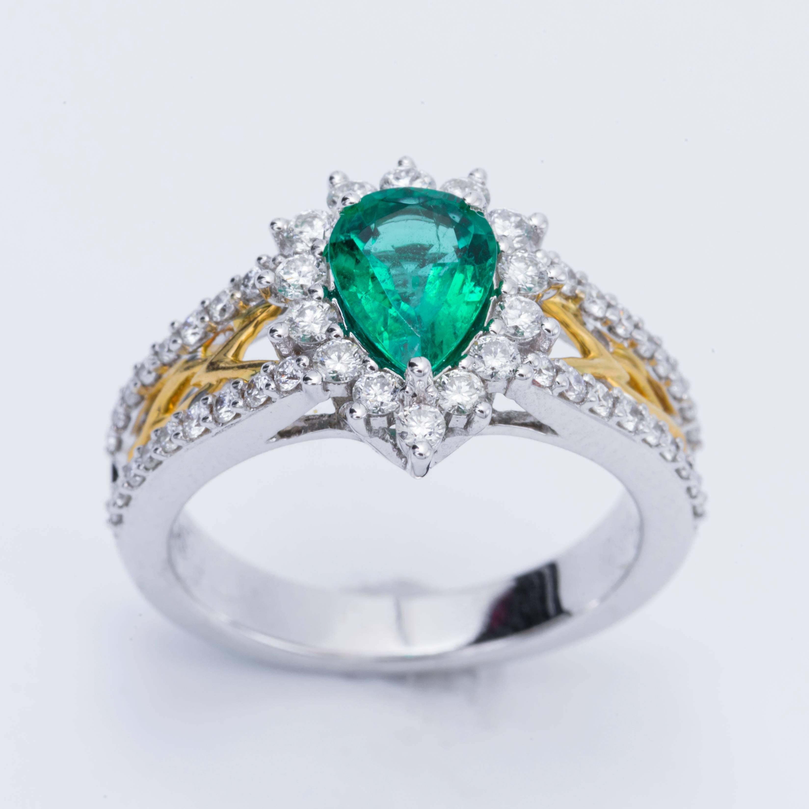 Contemporary Pear Shape Emerald and Diamond Halo Two-Tone Ring