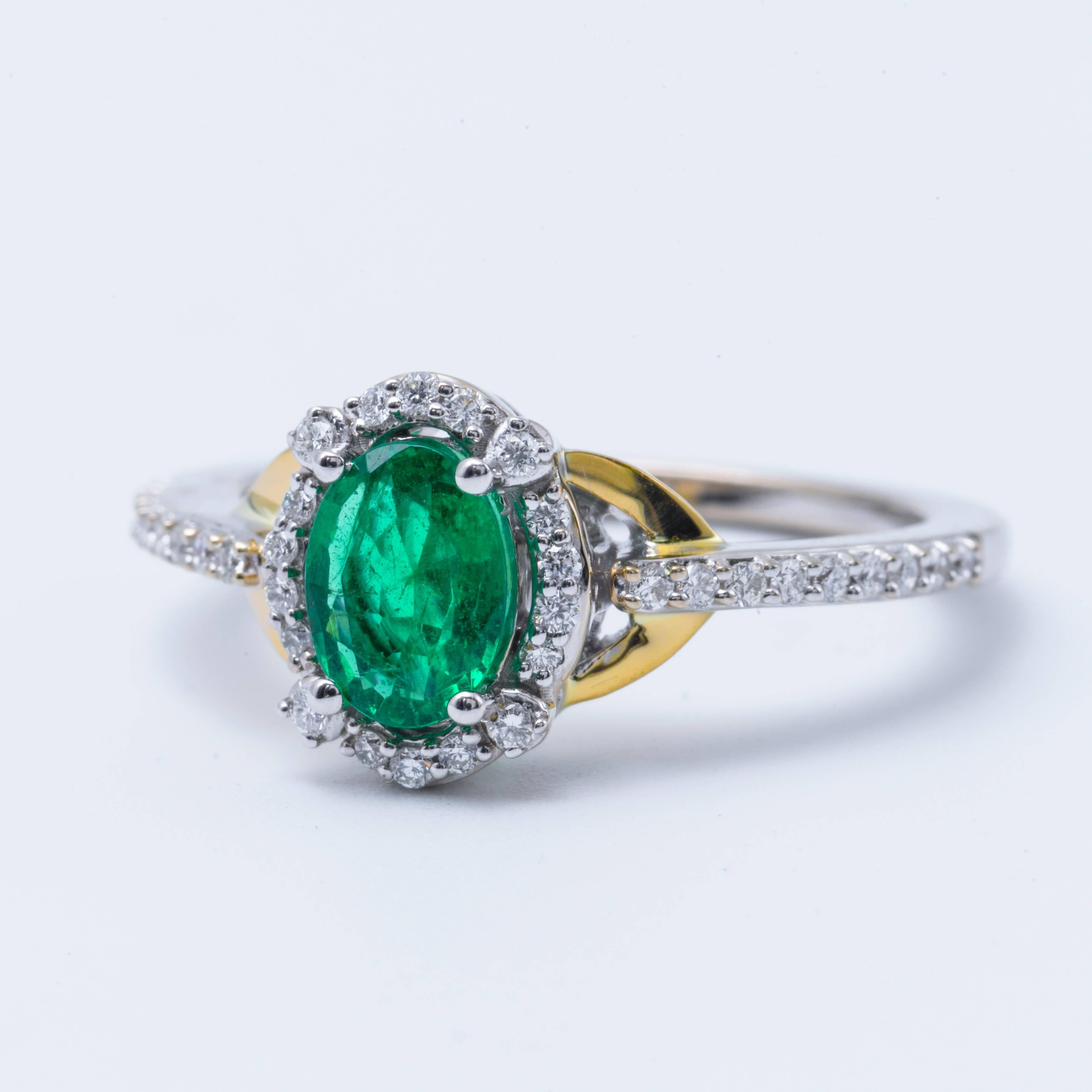 Contemporary Oval Emerald and Diamond Halo White and Yellow Engagement Ring