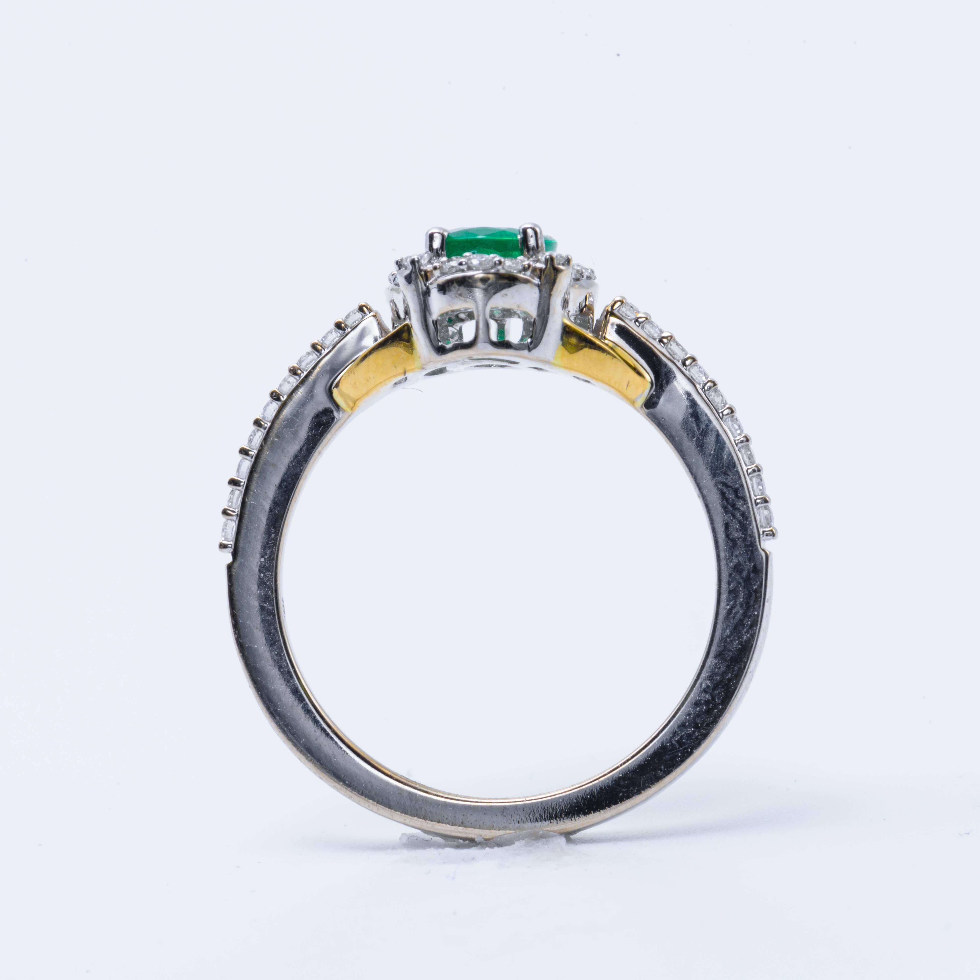 Oval Emerald and Diamond Halo White and Yellow Engagement Ring In New Condition In New York, NY