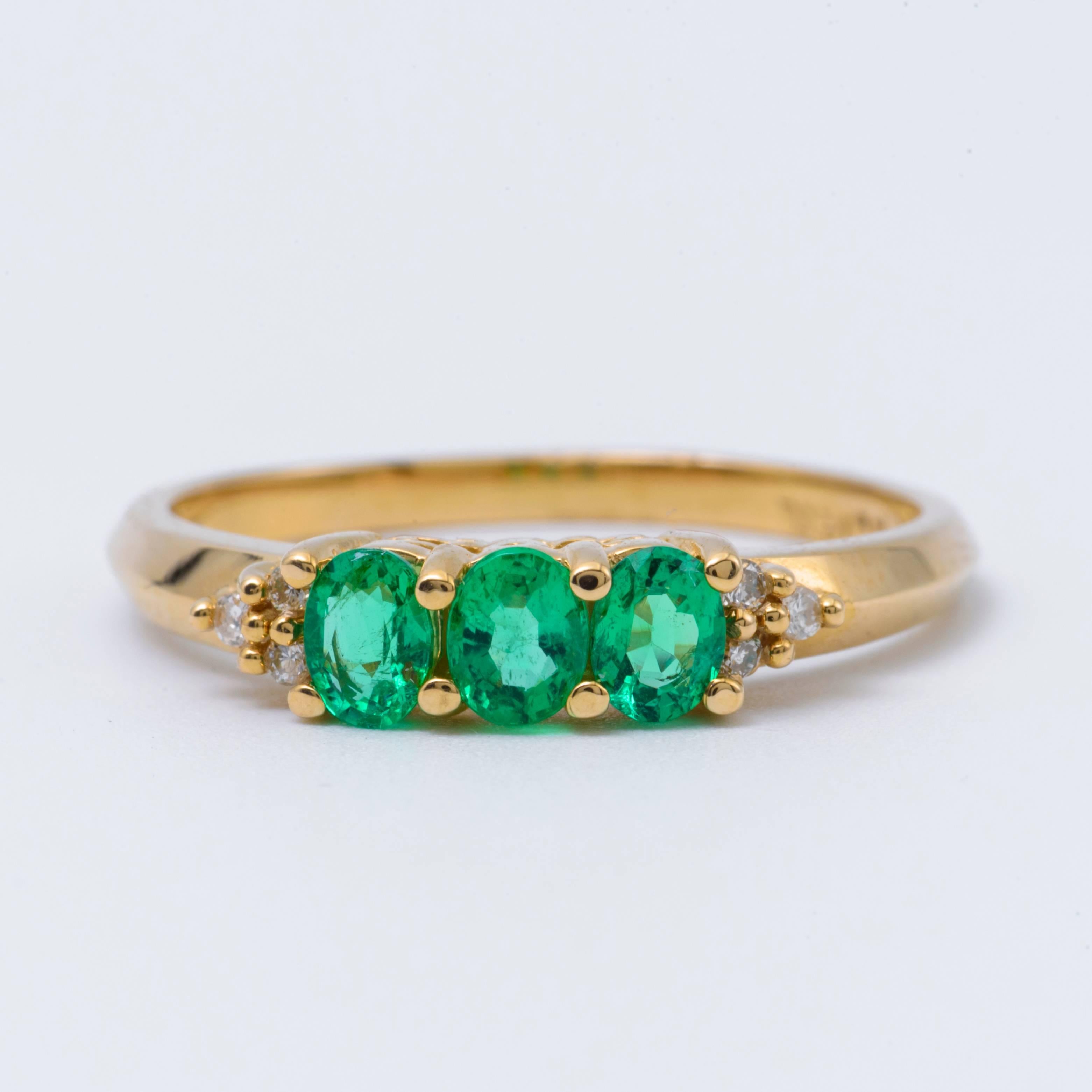 14 K Yellow Gold with Three Stone  Emeralds each one measuring 5x3 mm
for a total weight of 0.63 cts.
The Diamonds weight is 0.05 cts.