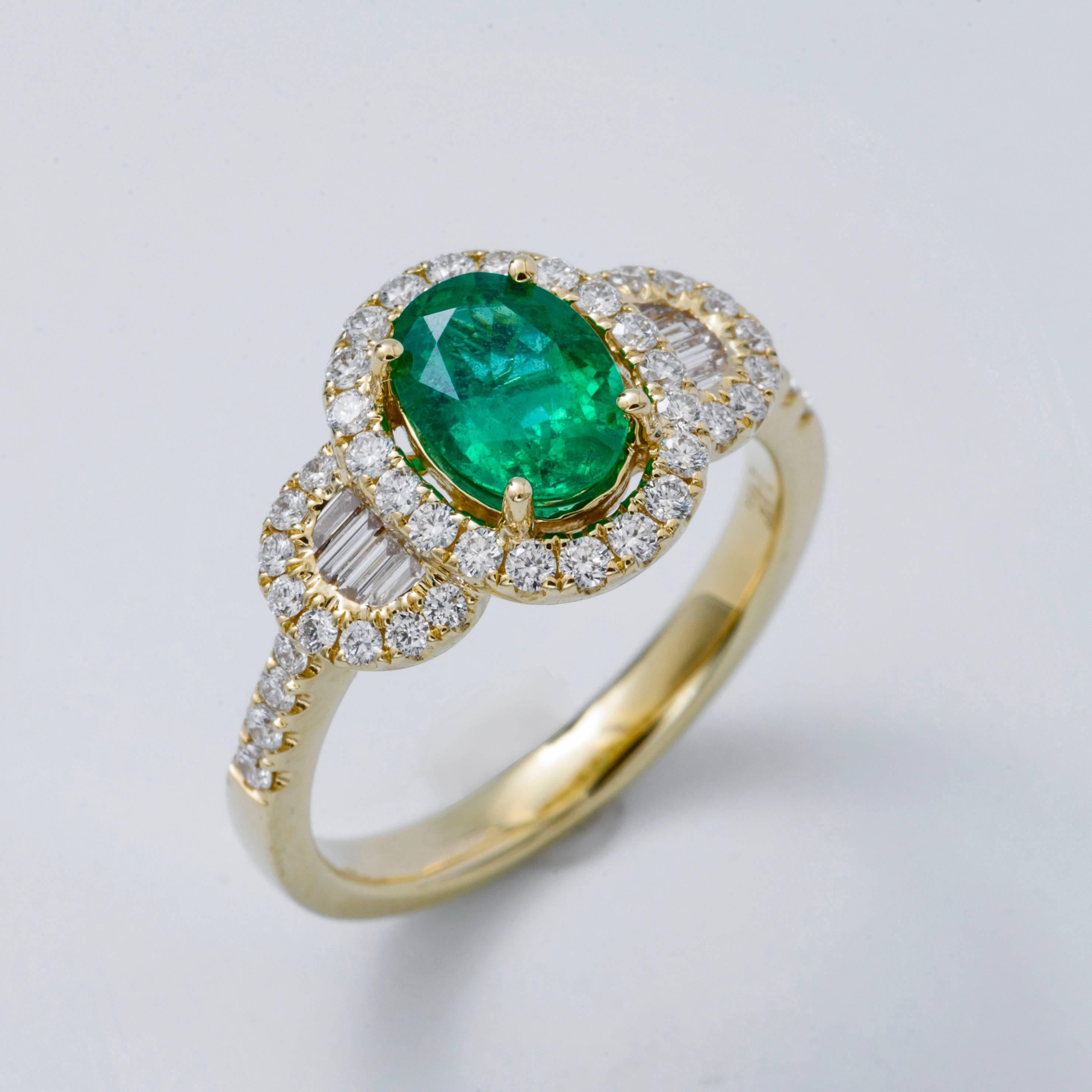 Style:  White Oval Shape Zambian Emerald Diamond Halo Engagement Ring
Material: 14 k Yellow Gold
Gemstone Details: 1 Oval Shape Emerald approximately 1.03 ct. 8x6 mm
Diamond Details: Approximately 0.58 ctw of diamonds. Diamonds are G/H in color and