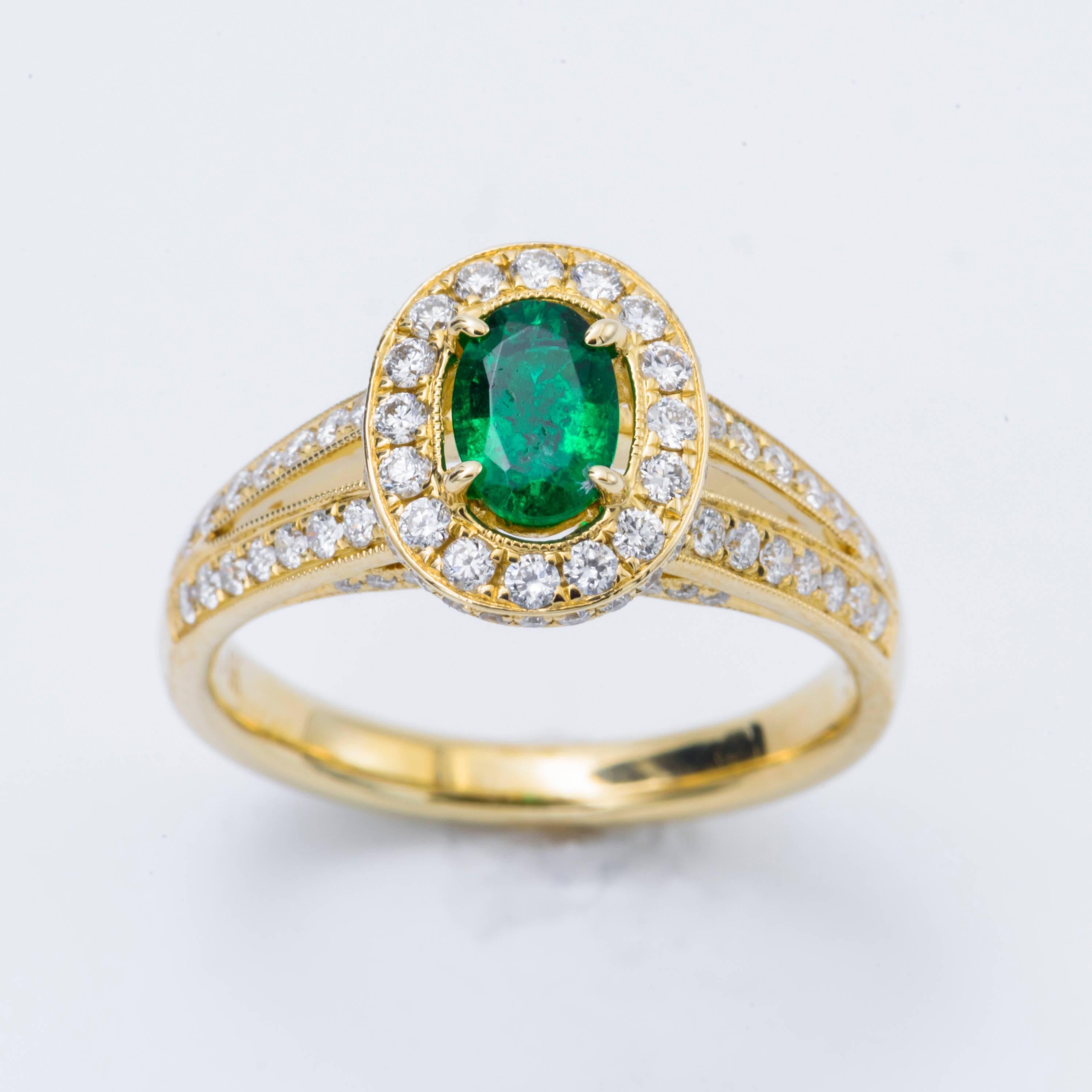 Style: 14k Yellow gold Oval  Shape Zambian Emerald  Diamond Halo Engagement Ring
Material: 14k Yellow Gold
Gemstone Details: 1 Oval Shape Emerald approximately 0.54 ct. 6x4 mm
Diamond Details: Approximately 0.66 ctw of diamonds. Diamonds are G/H in