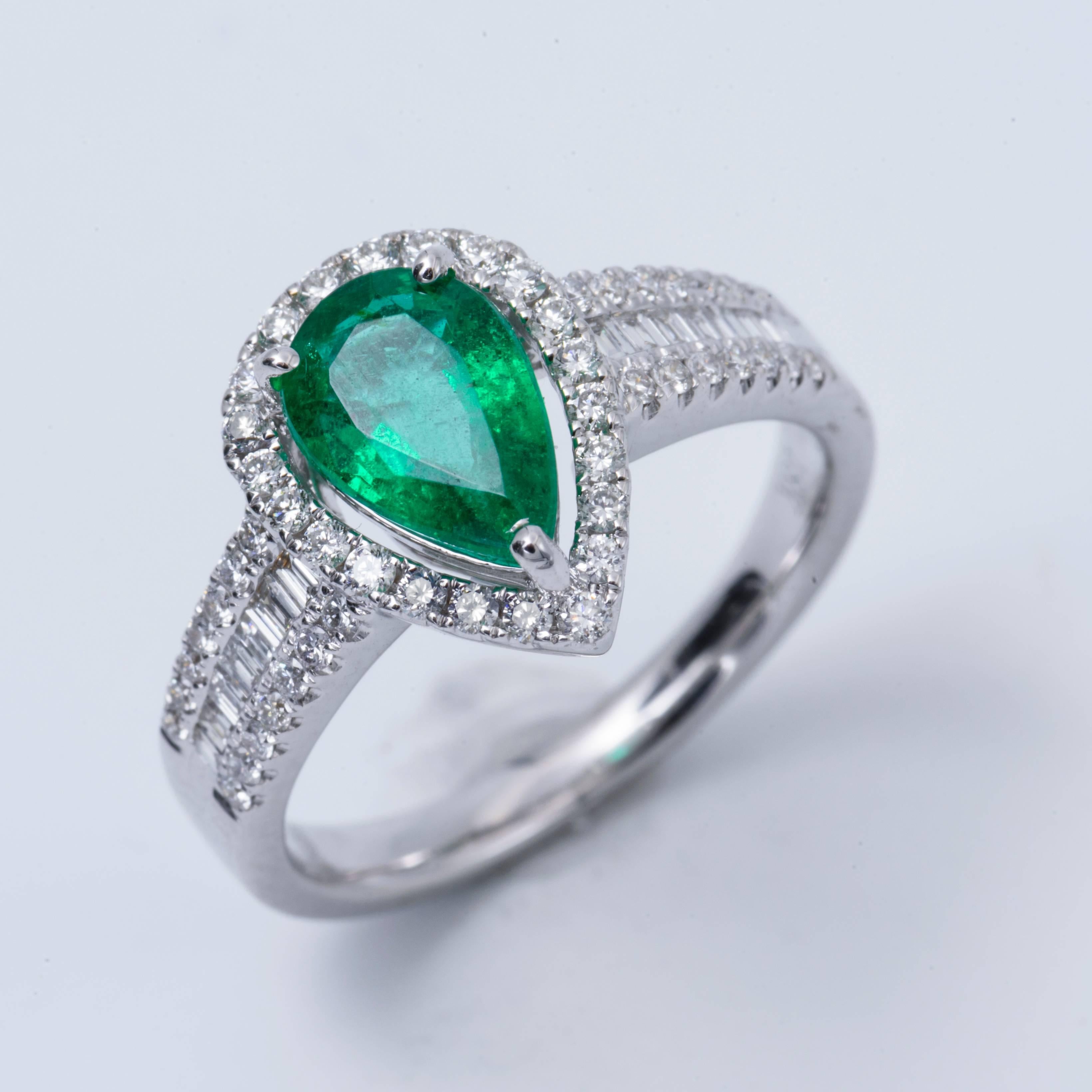Style: 18k White Pear Shape Emerald Diamond Halo Engagement Ring
Material: 18k White Gold
Gemstone Details: 1 Pear Shape Emerald approximately 1.26ct. 8x6 mm
Diamond Details: Approximately  0.53ctw of diamonds. Diamonds are H-I in color and SI in