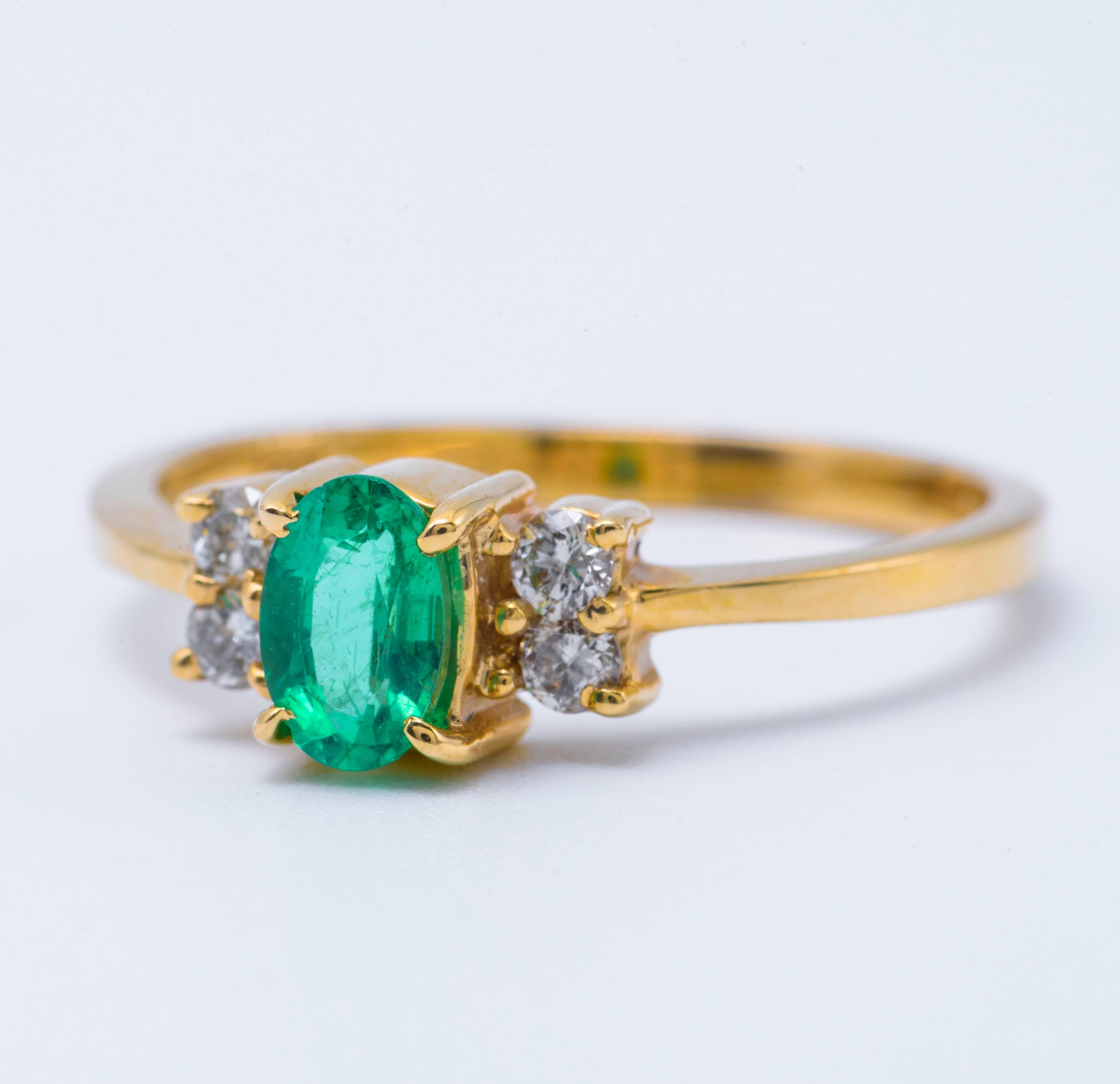 Style: 14k Yellow Oval Shape Emerald  Diamond  Engagement Ring
Material: 14k Yellow Gold
Gemstone Details: 1 Oval Shape Zambian Emerald approximately 0.37ct. 5x3 mm
Diamond Details: Approximately 0.14ctw of diamonds. Diamonds are H in color and SI