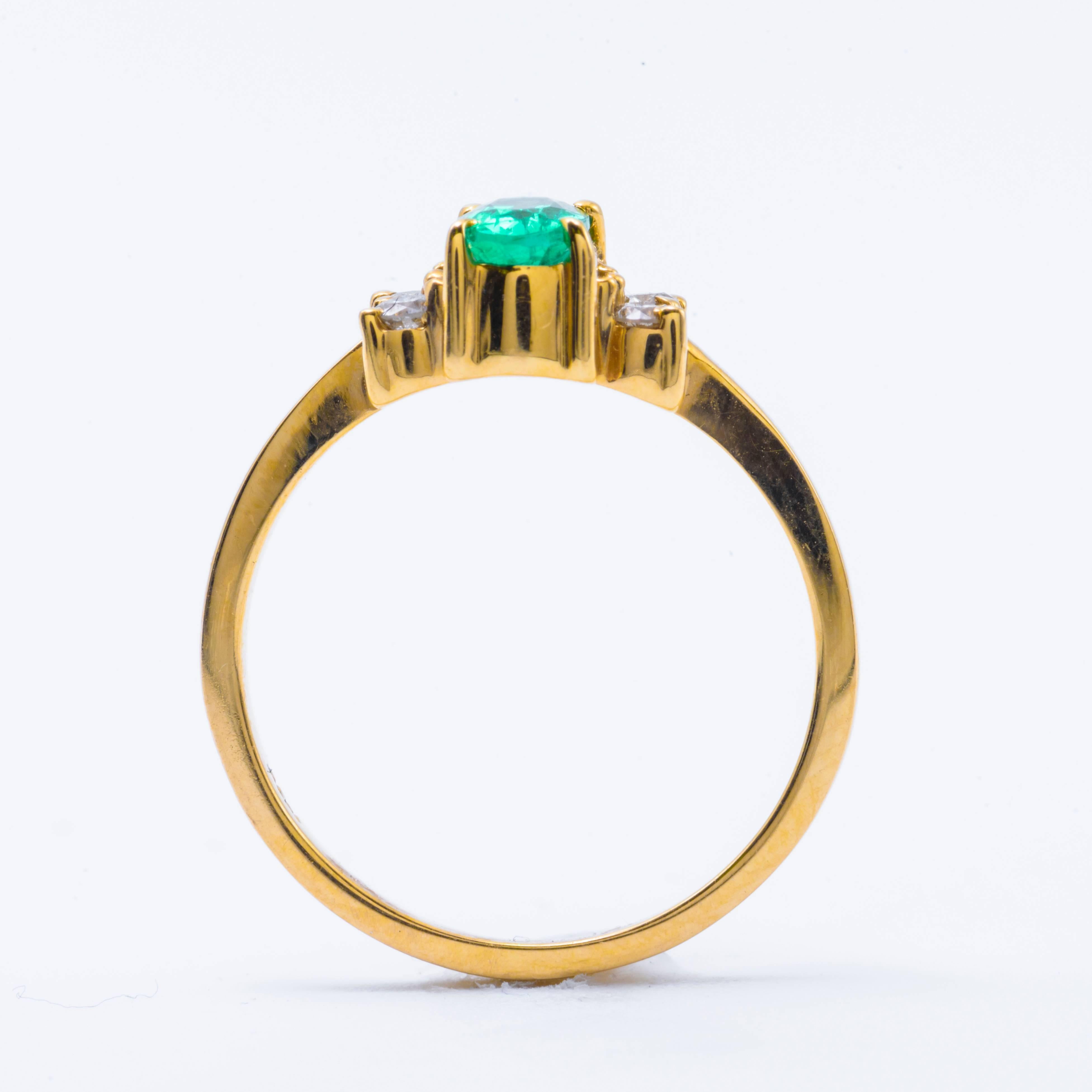 Women's Oval Shaped Emerald and Diamond Engagement Ring in Yellow Gold