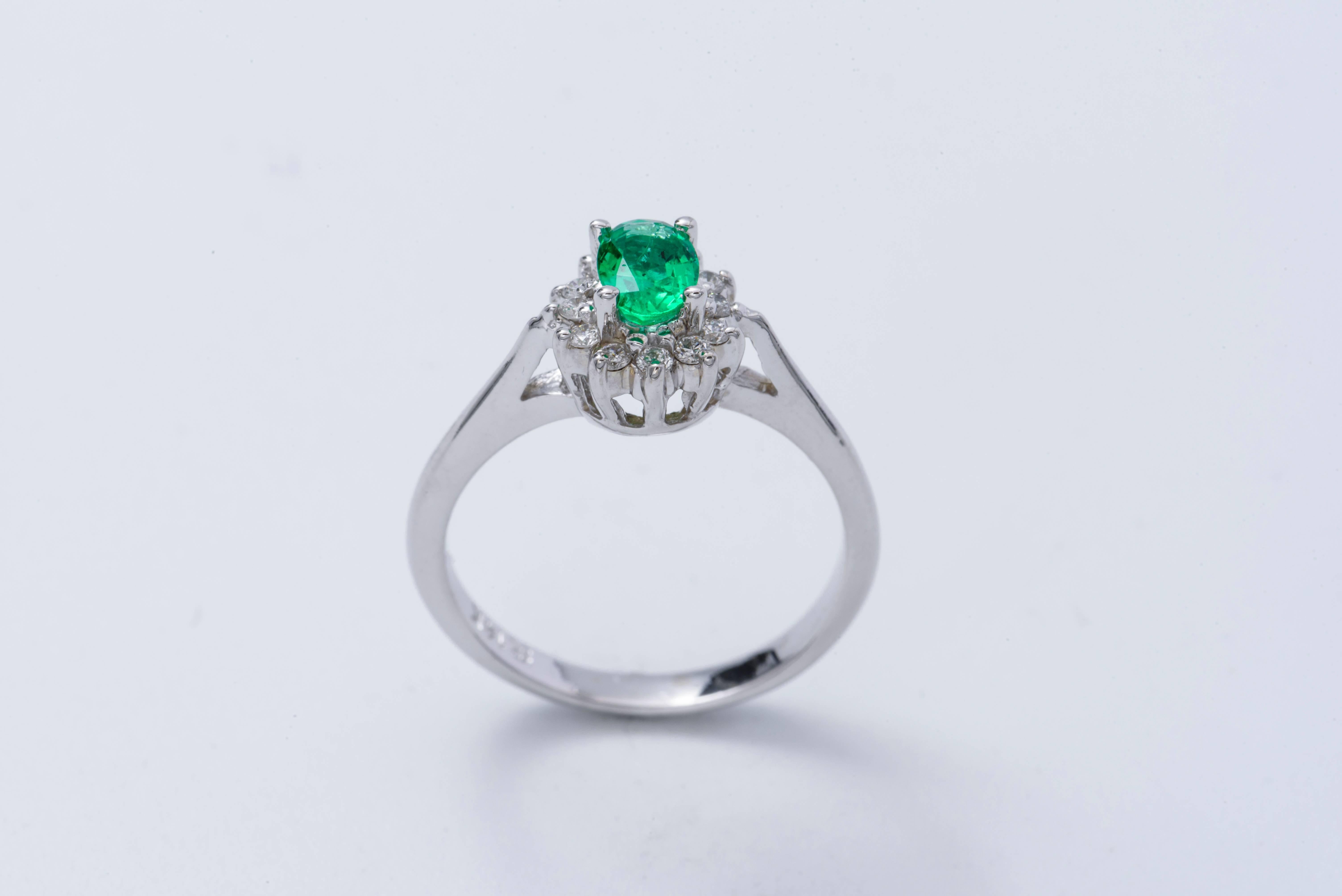 Oval Shape Emerald and Diamond Halo Engagement Ring In New Condition In New York, NY