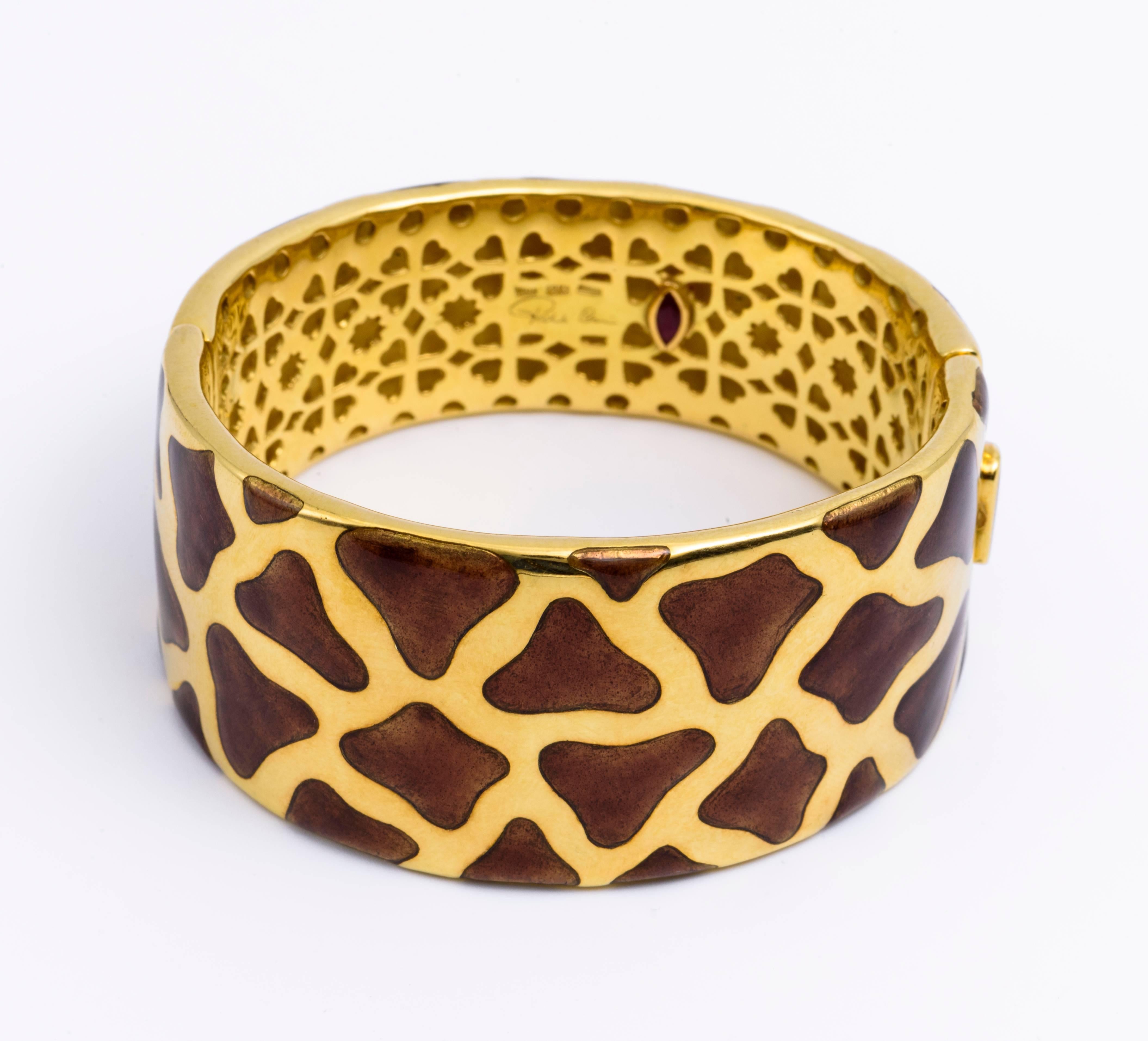 Brown and Yellow Gold Bangle designed in animal print with intricate details on back. 
Roberto Coin played upon the fashionable style of animal-print : the Panda! This bracelet is made of 18K yellow gold with a yellow gold interior accented with a