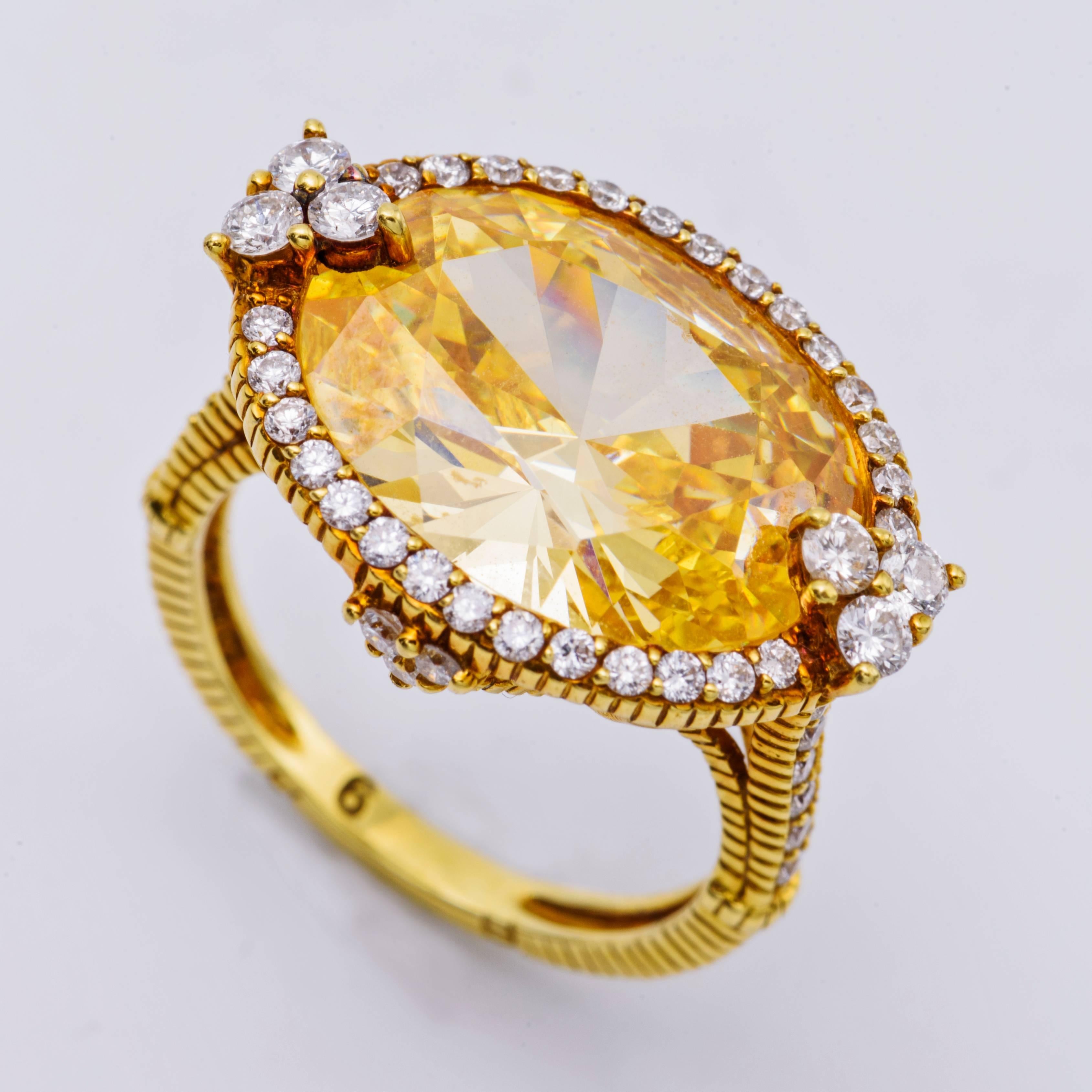 Judith Ripka Stunning Canary Color Topaz Ring crafted in 54 round White Diamonds.
Set in 18 Karat Yellow Gold.