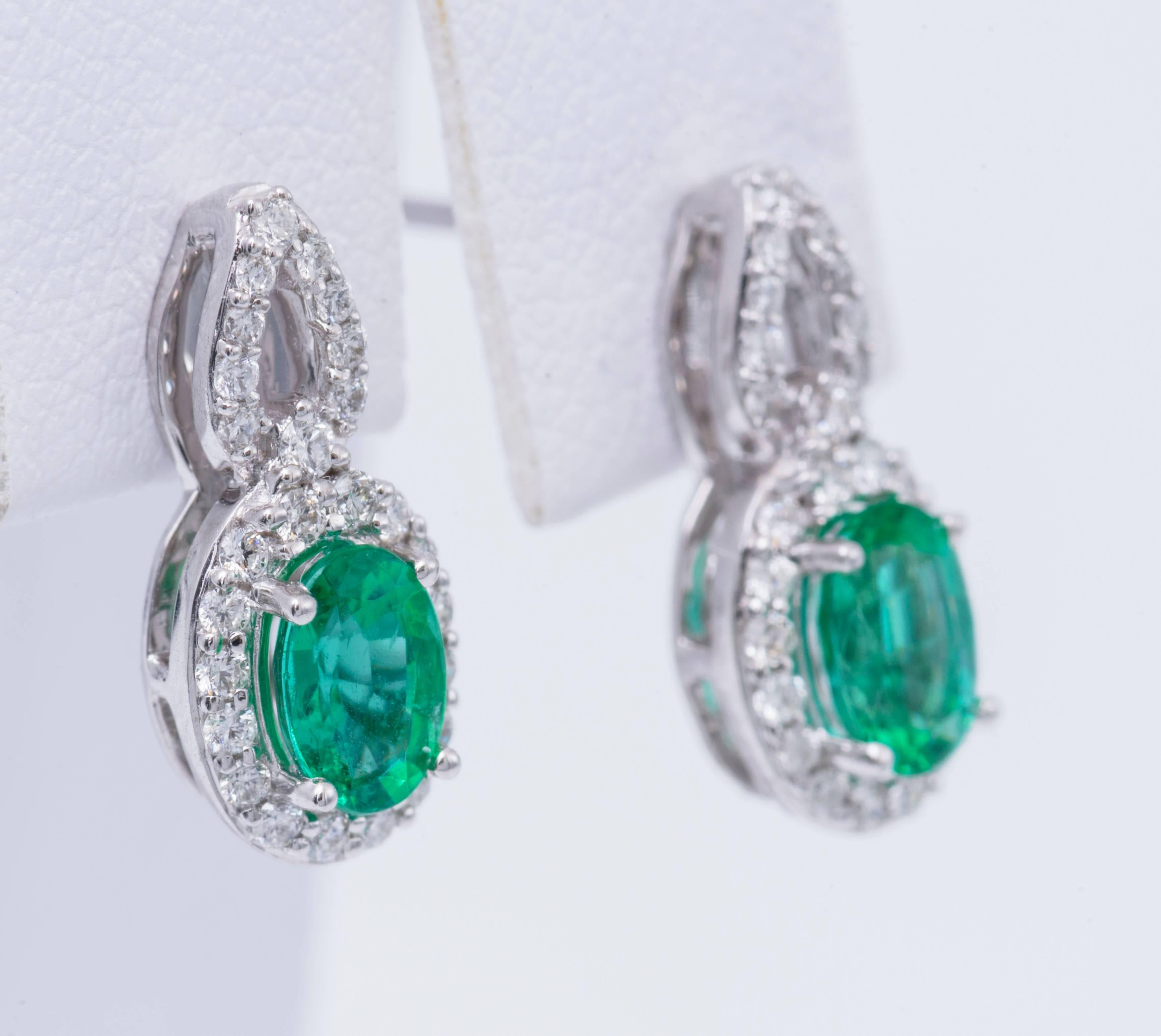 Emerald measuring 6mm  X 4mm each for a total weight of 0.82 Cts.
14K  gold
The earrings measure 1.5 cm x 6 mm