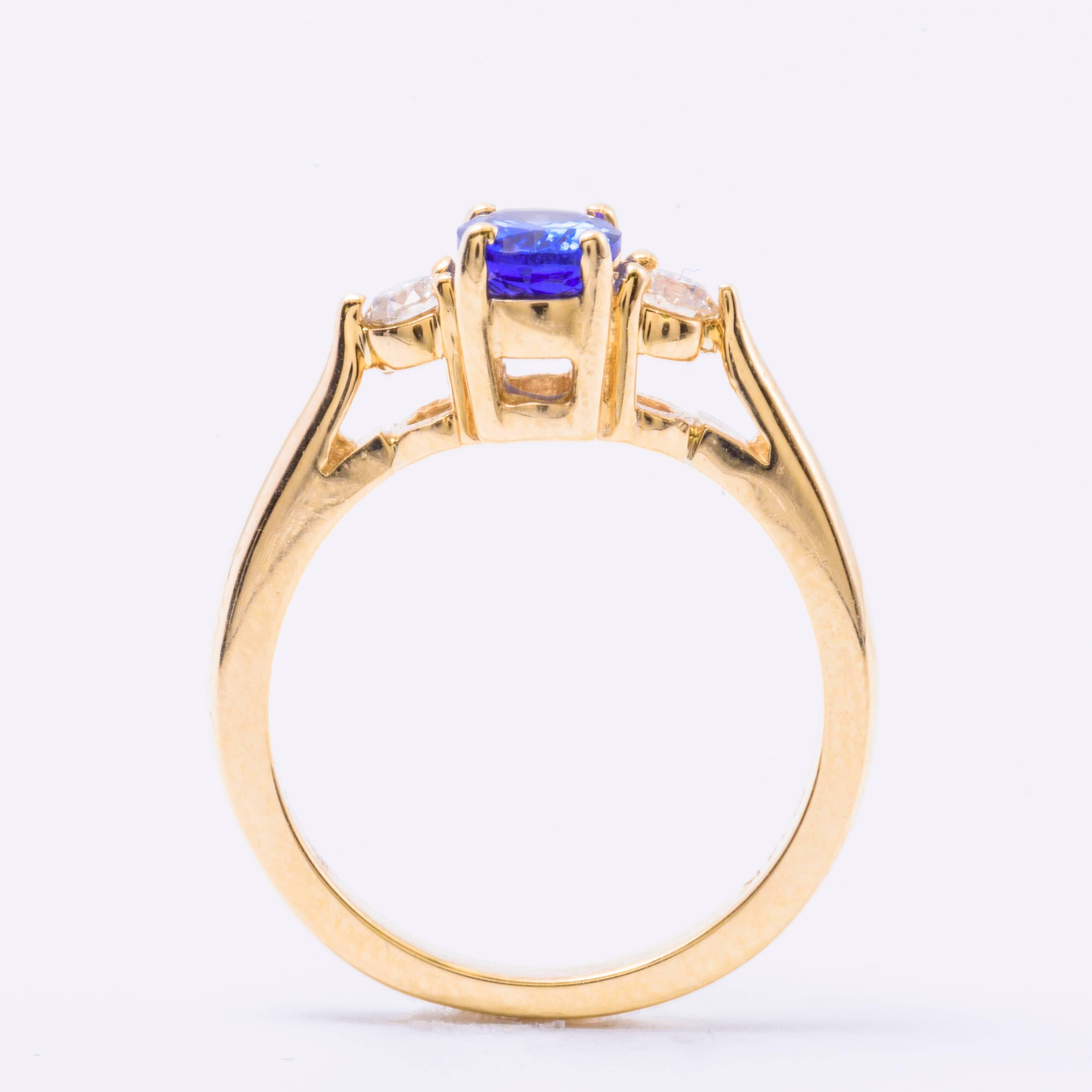 Contemporary Oval Tanzanite Diamond Gold Three-Stone Engagement Ring