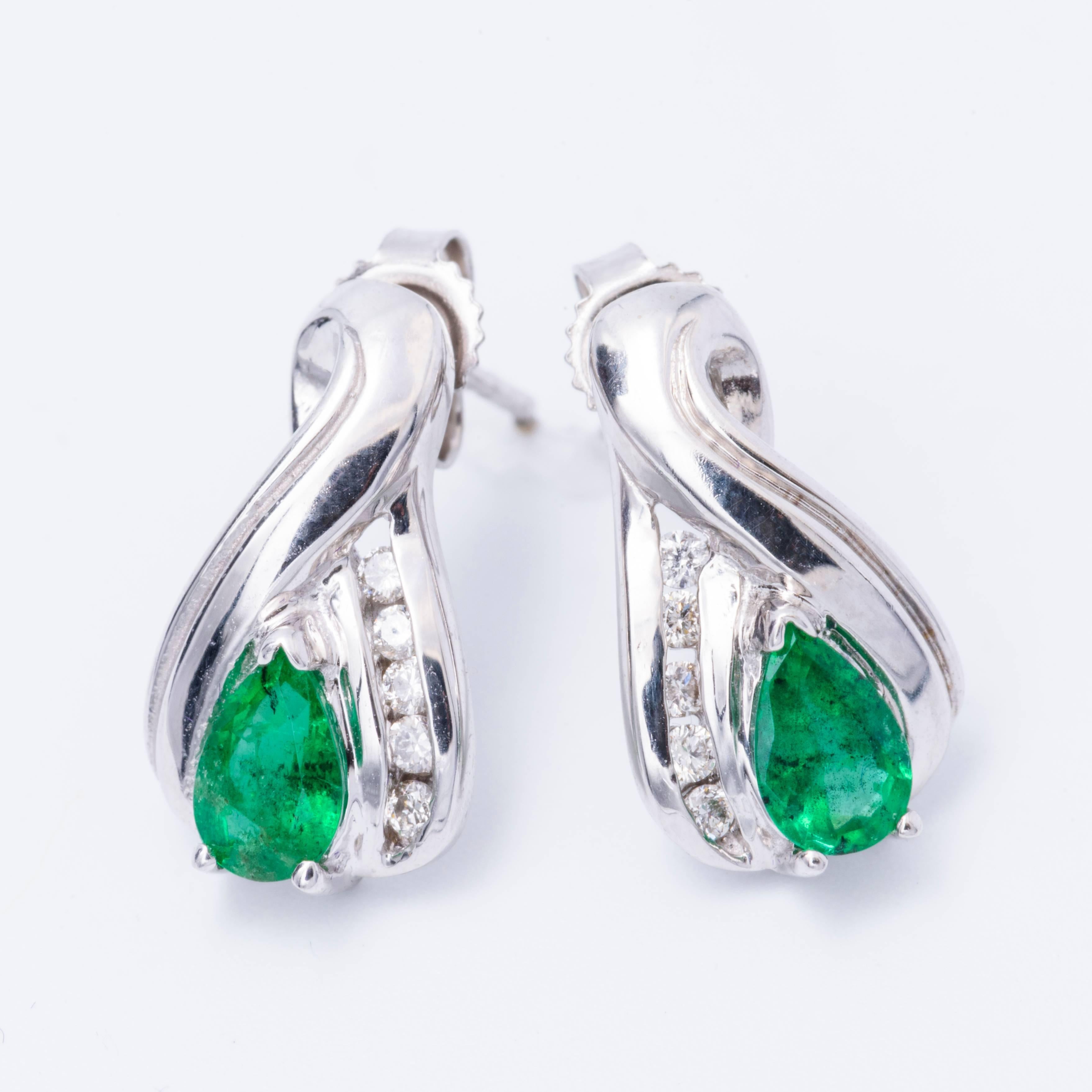 14 K White Gold 
Pear Shape Emerald 0.68 Carats total weight each measuring 5 x 3 mm
1.5 x 8 mm Earrings Dimensions
Diamond total weight 0.12 Cts.