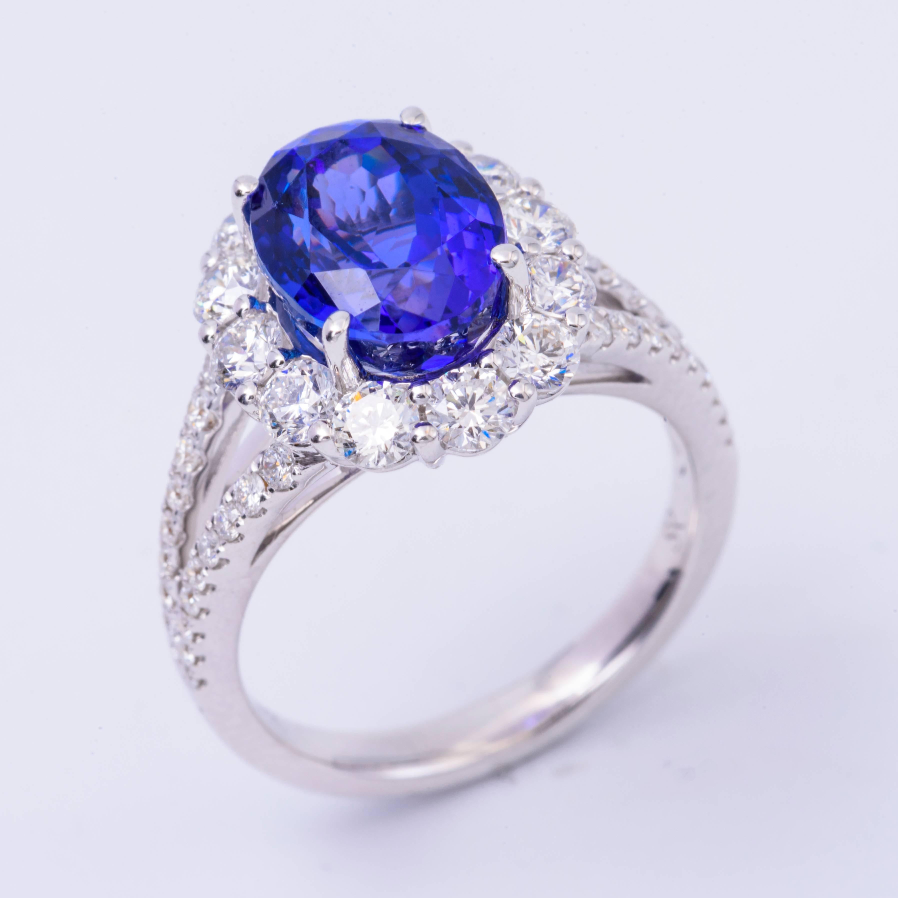 Beautiful crafted in 18K White gold this ring features a 10x 8 mm Tanzanite for a total weight of approximately 4.85 Carats 
The diamonds surrounding this beautiful stone has an approximate total weight of 1.53 Carats.
All our gemstones are genuine,
