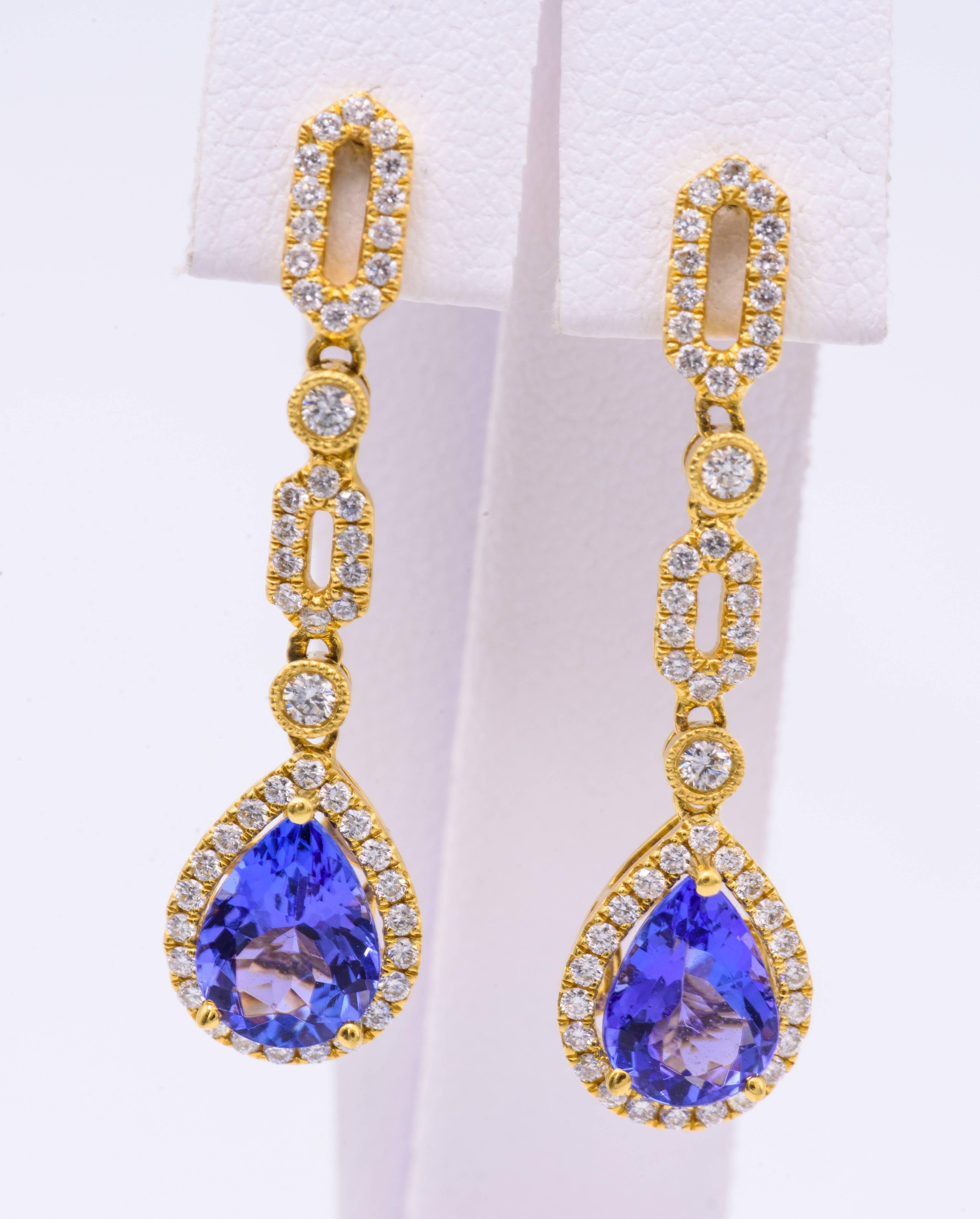 Pear Shape Tanzanite measuring each 8 x 6 mm for a total weight of 2.10 Cts.
Diamond Weight: 0.47 Cts.
Earring measuring 32 x 9 mm