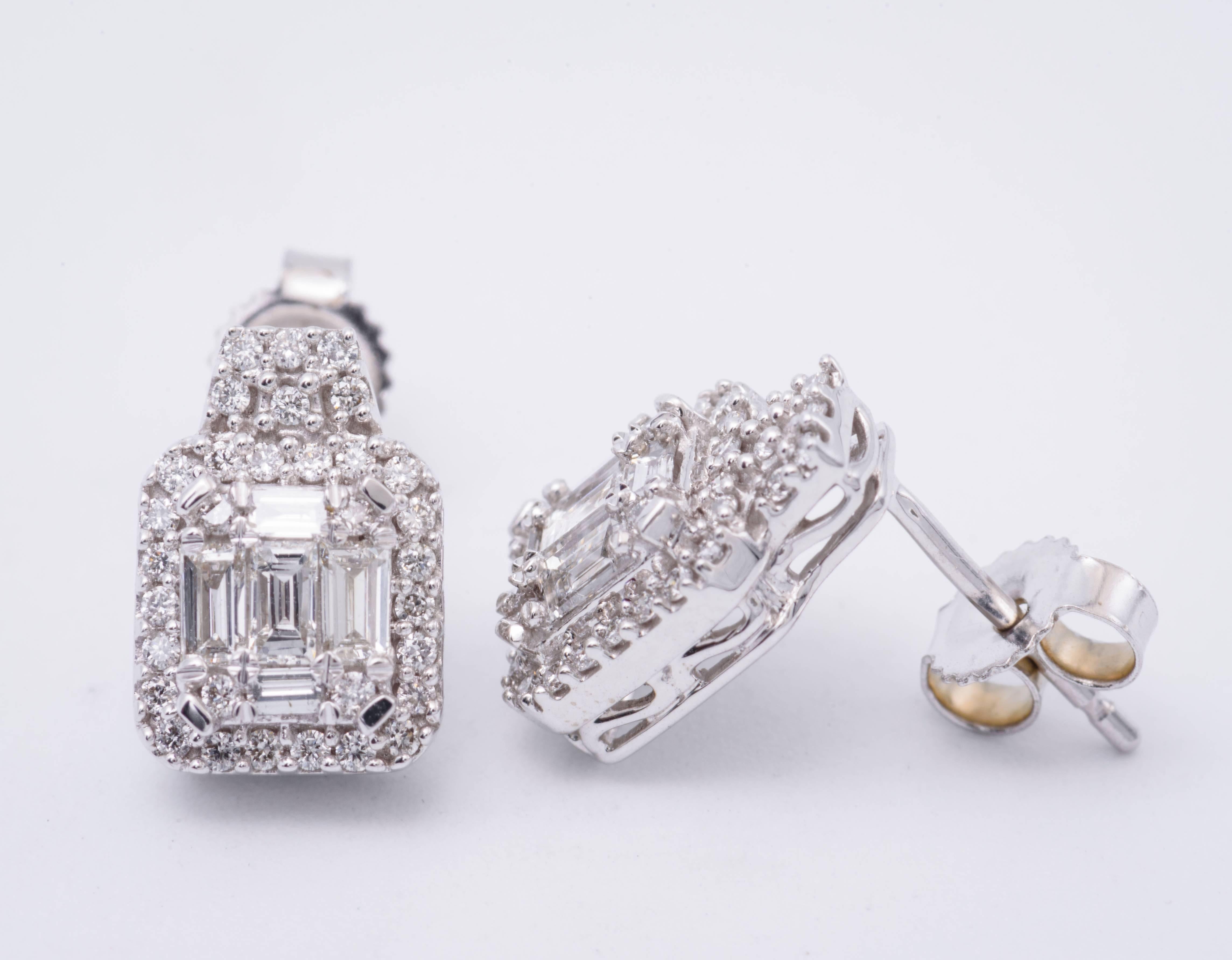 Diamonds: 0.55 Carats
14K White Gold
Earrings Measuring 10.5 mm X 7.5  mm
