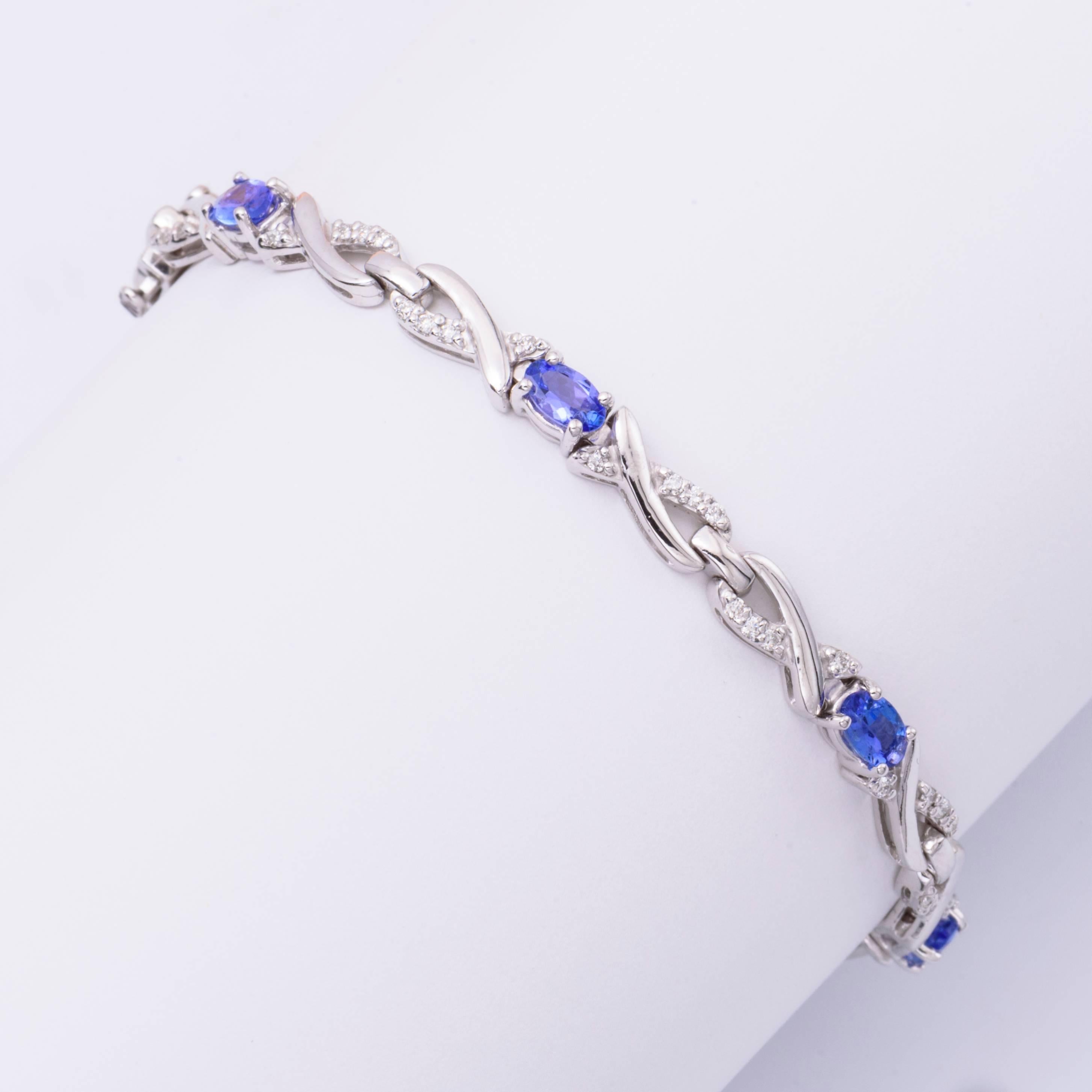 Beautiful 14K white gold with Tanzanite measuring each 5X3 mm for a total weight of: 1.68 Cts.
Diamonds: 0.40 Cts.