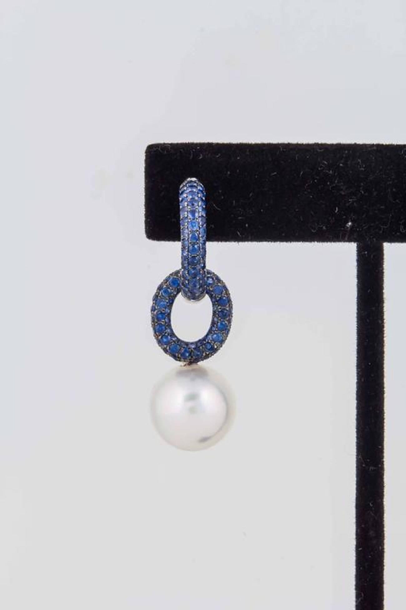 18K White Gold sapphire Hoop Earrings 
3.00 carats Total Sapphire Weight
Weight 6.5G 
South Sea Pearl 12-13mm