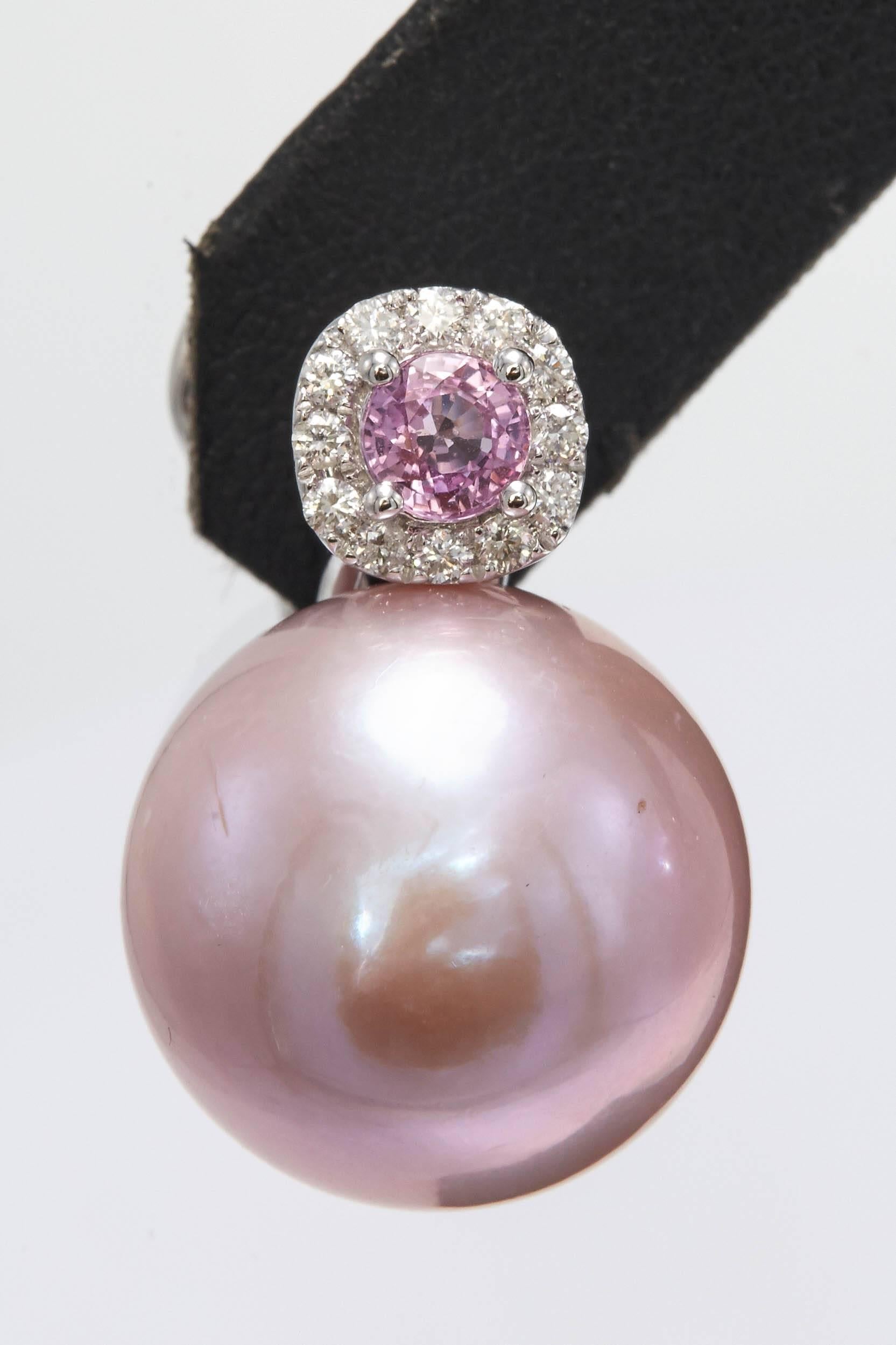 18K white Gold
Pink freshwater pearl 14-15 mm 
Pink Sapphire 0.65 cts.
Diamonds: 0.24 Cts.
