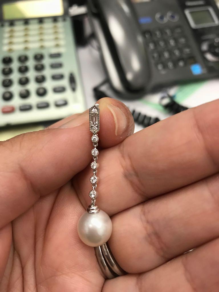 This  Earring features:
Pearl size : 10-11mm
Nature: Tahitian Cultured Pearl
Luster: AAA Exc.
Nacre: Very Thick
Metal Purity: 18k
Metal Type: White Gold Earrings
Metal Weight: 3.4g
Diamond Count: 16
Diamond Weight: 0.32
It can be ordered with South