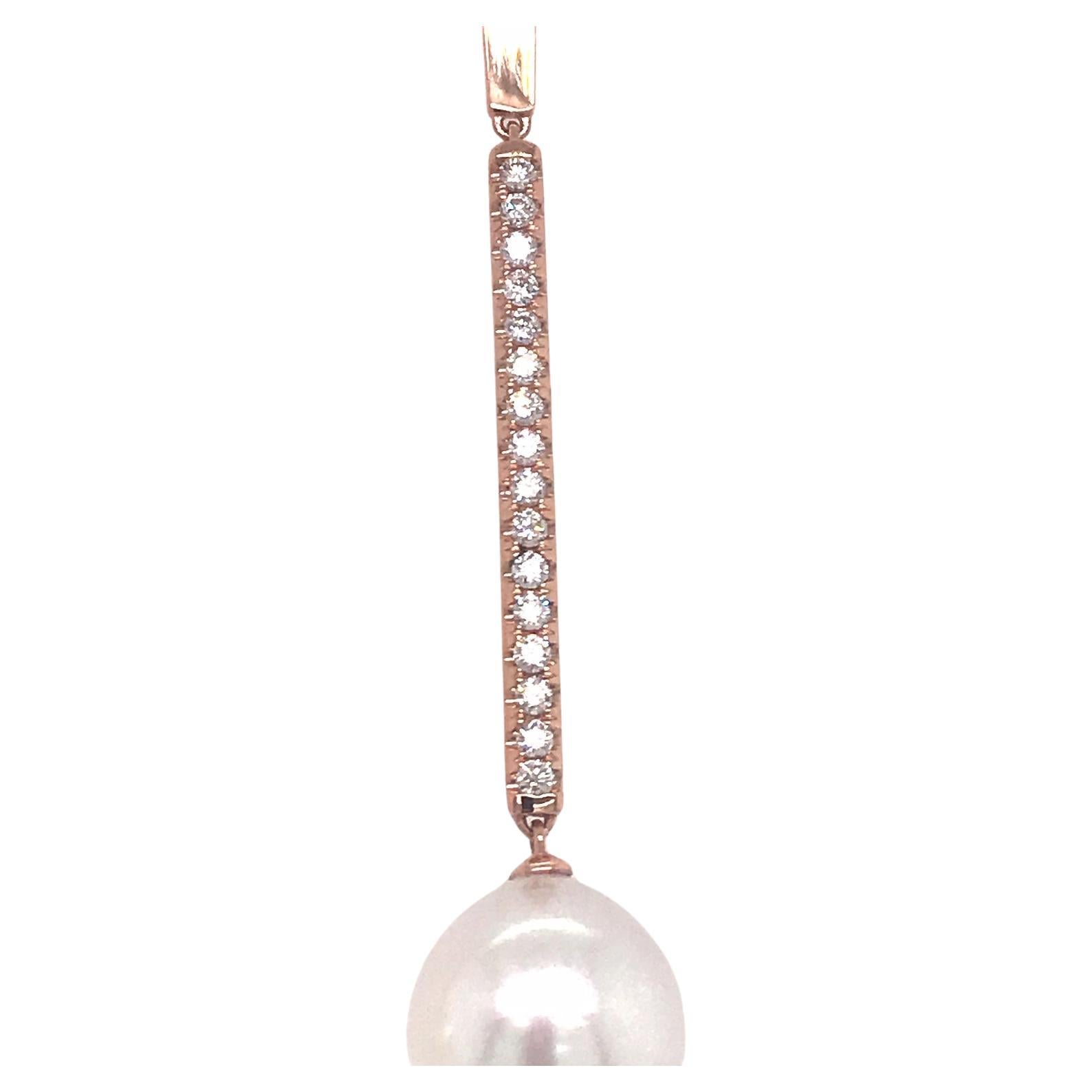 18K Rose gold drop earrings featuring two South Sea pearls measuring 12-13 mm with a diamond bar containing 32 round brilliants weighing 0.63 carats.
Color G-H
Clarity SI
Comes in White Gold

Measurements:
South Sea Pearl: 12-13 MM
Diamond Bar: