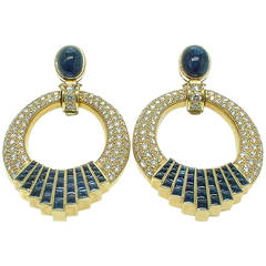 Sumptuous day and night yellow gold diamond sapphire earclips