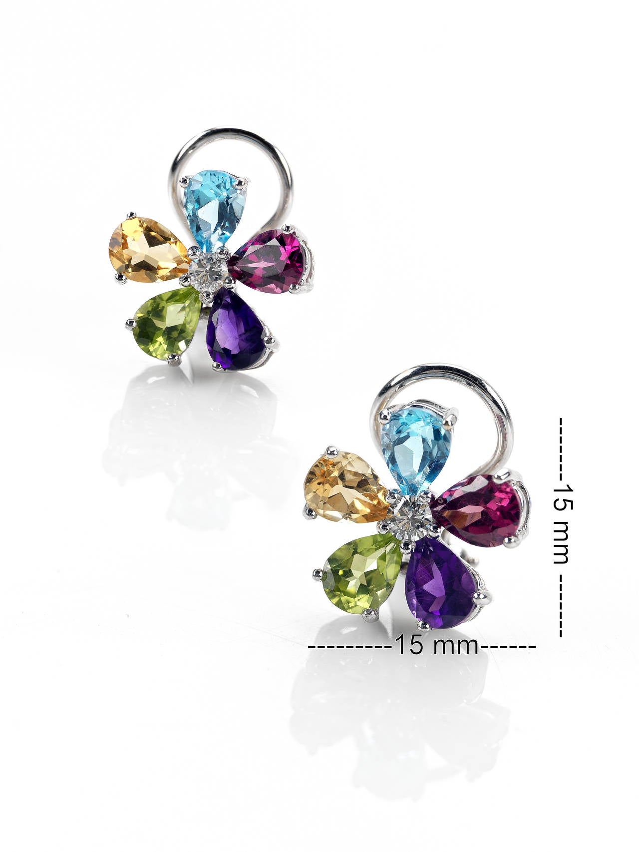 Each flowered set with five amethyst peridot tourmaline topaz and citrine petals, to the brilliant-cut diamond centre.