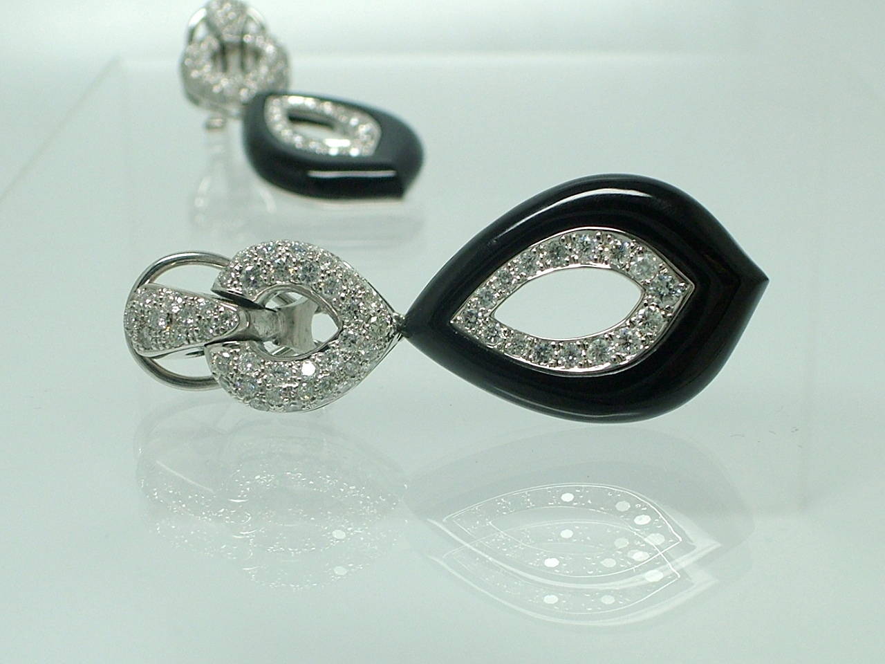 Fantastic earrings set with diamonds weighing approx. 2.46ct. and black onyx, mounted in 18K white gold.