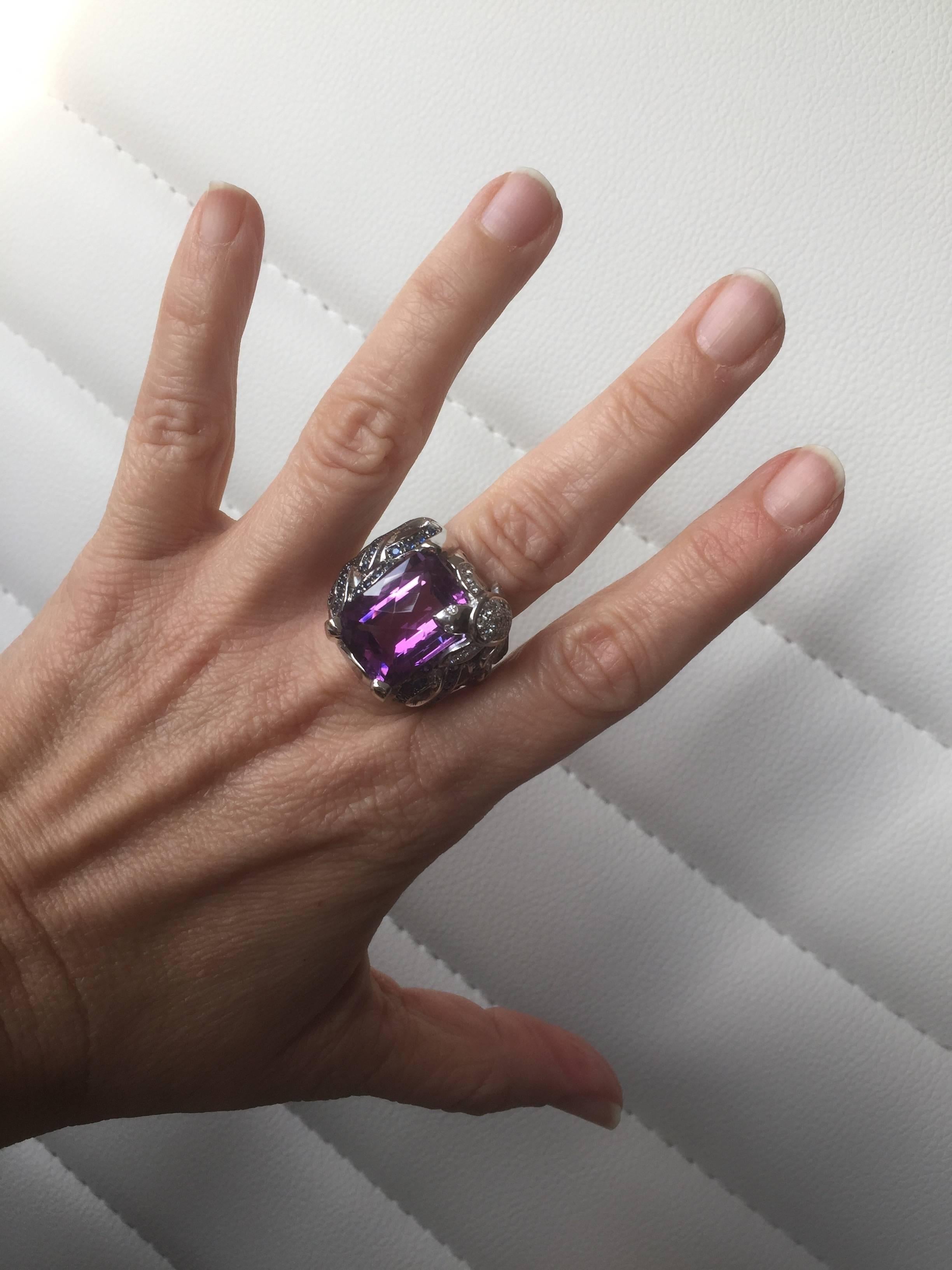 Modern figurative high ended design ring mounted in 18K white gold. 
The striking Amethyst seams to be the place where a sweet diamond set turtle wants to be. Mounted in 18K white gold, the central amethyst measuring 18,3x13mm accented by blue