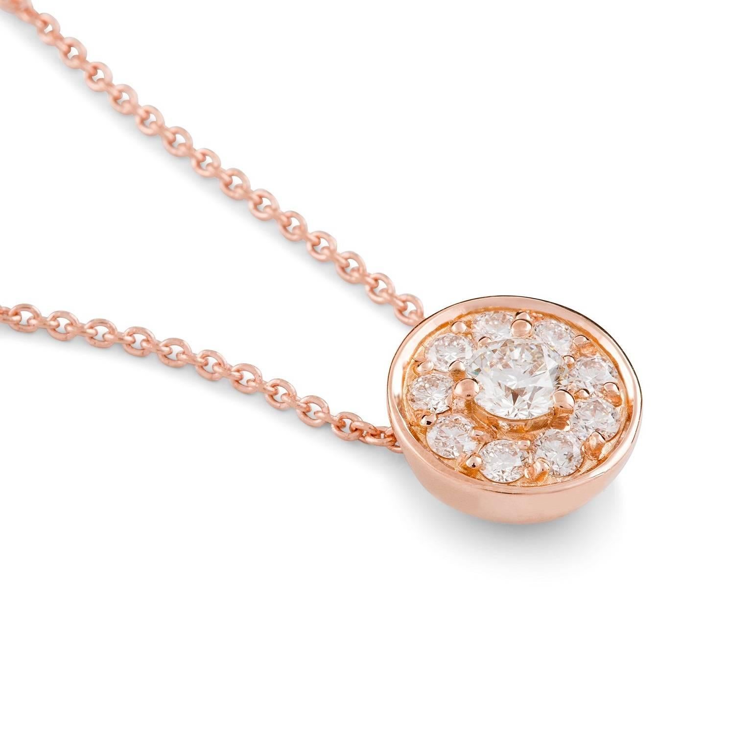Rosa Halo Necklace

This gorgeous petite pendant features a stunning white round brilliant cut  diamond surrounded by a halo of white diamonds. The circular setting is suspended from an elegant 18 carat rose gold trace chain.

Round brilliant cut