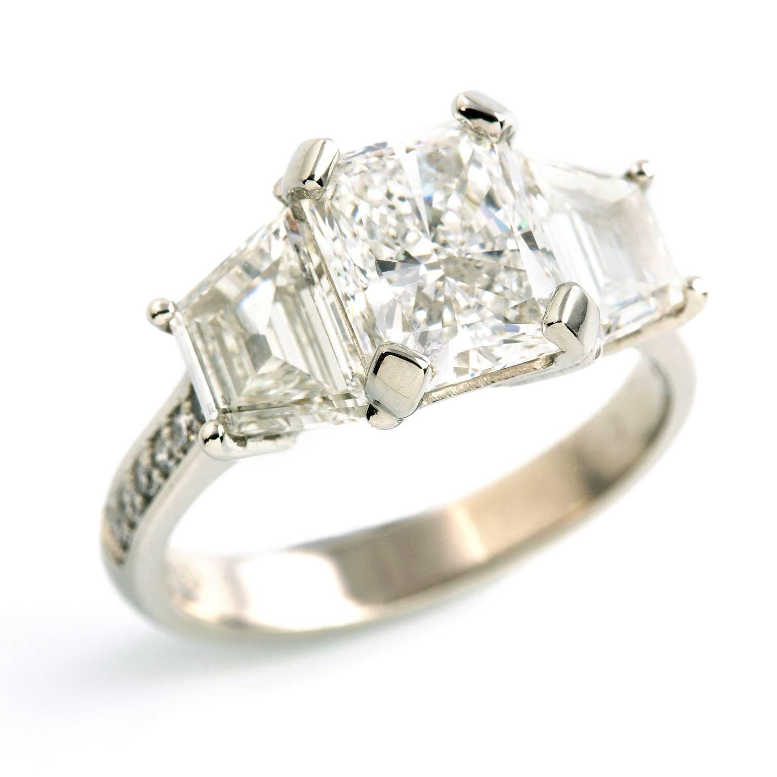 Platinum Diamond Ring

This breathtaking beauty is set with three of the finest quality diamonds. The platinum band is further bead set with twelve petite diamonds of similar fine quality.

Corner rectangular modified brilliant cut: GIA certified, D
