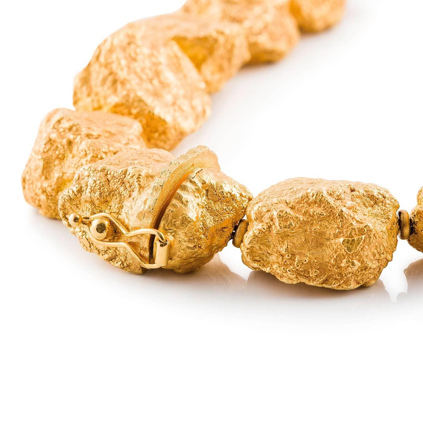 Pepite D'oro

This fancy dress piece of substantial heft is comprised of 18ct yellow gold hollow links that are fashioned in the shapes of gold nuggets.

Length: 48.0cm

Weight: 53.0g

 