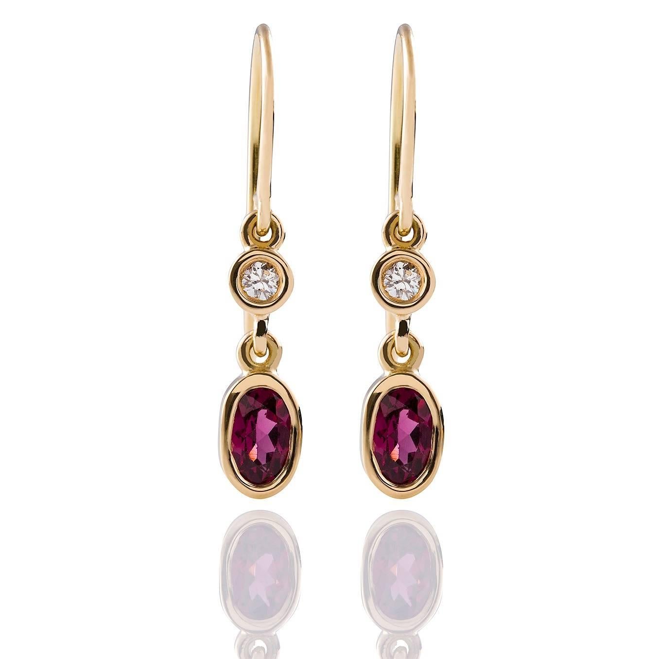 Rosa Granato Earrings

These gorgeous drop style earrings in 18ct yellow gold each have a beautiful chenier set rhodolite garnet and diamond pair.

Oval faceted rhodolite garnets: medium pink colour, 6.0 x 4.0mm each

Round brilliant cut diamonds: G