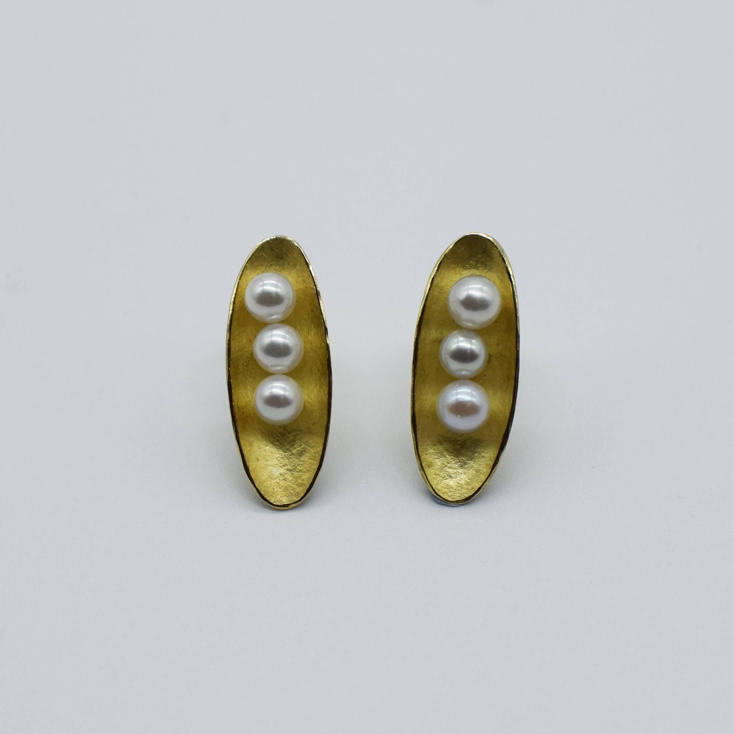 This 18ct gold and Akoya pearl earrings are all hand crafted.  Akoya pearls are cultured in Japan and they have a high luster. The earring have a delicate texture of gold that gives a soft warm feel to the piece, with only the polished edges