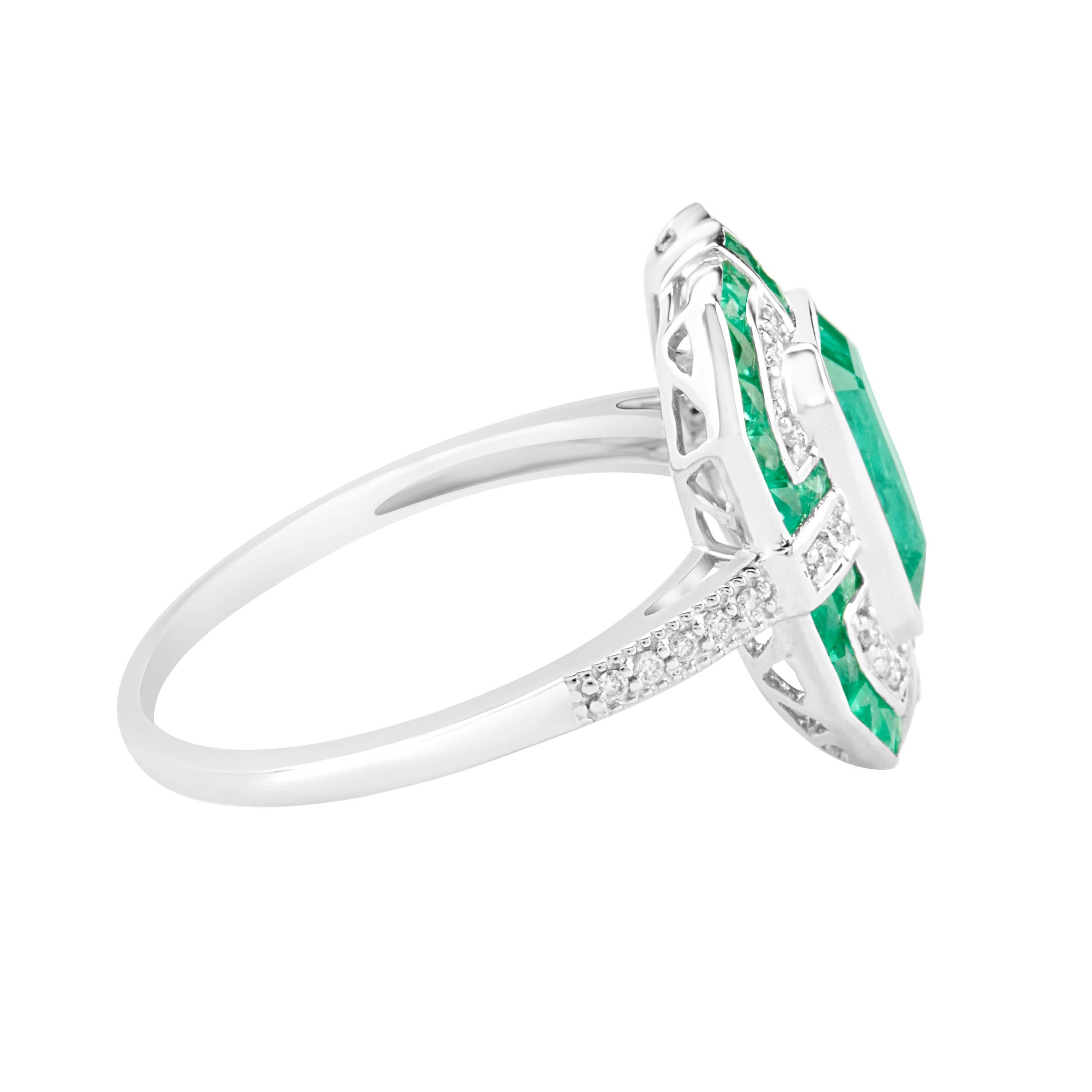 A stunning and impressive Zambian Emerald  and Natural Diamond 18kt gold ring. 
A one-off top pick from our jewelry collections.
Emerald Weight: 2.08 Carats. 
Diamond weight: 0.15 Carats.
All stones are VS-SI in clarity and are GH in colour.
GIL
