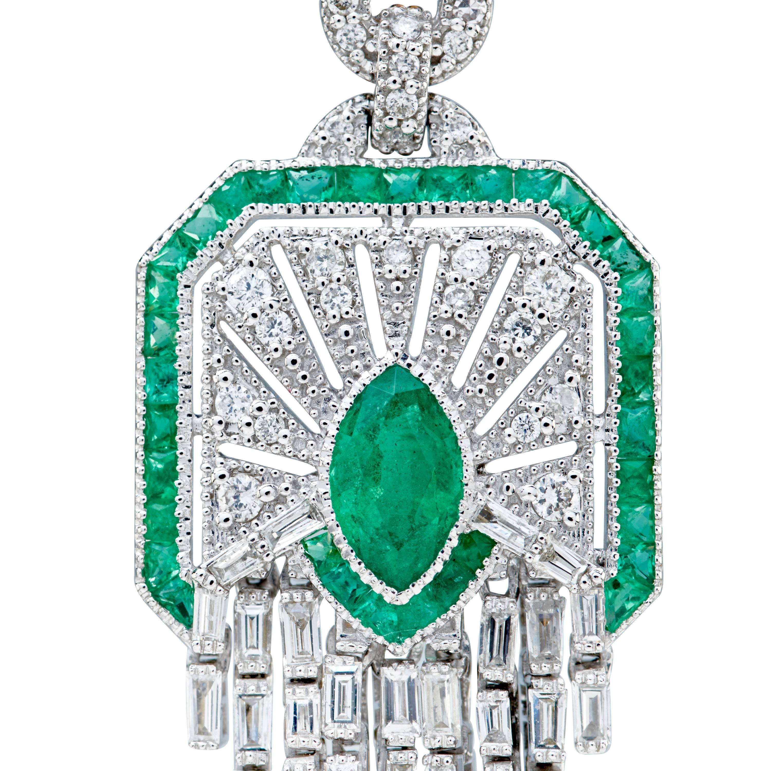 These earrings are a masterpiece. 
The Earrings consist of White Gold and Rose Gold bezel set Marquise Cut Natural Emerald that surround the beautiful stone with a bead set Baguette Cut and Round Cut Natural Diamond. 
The Emerald weighs 8.08 Carats.