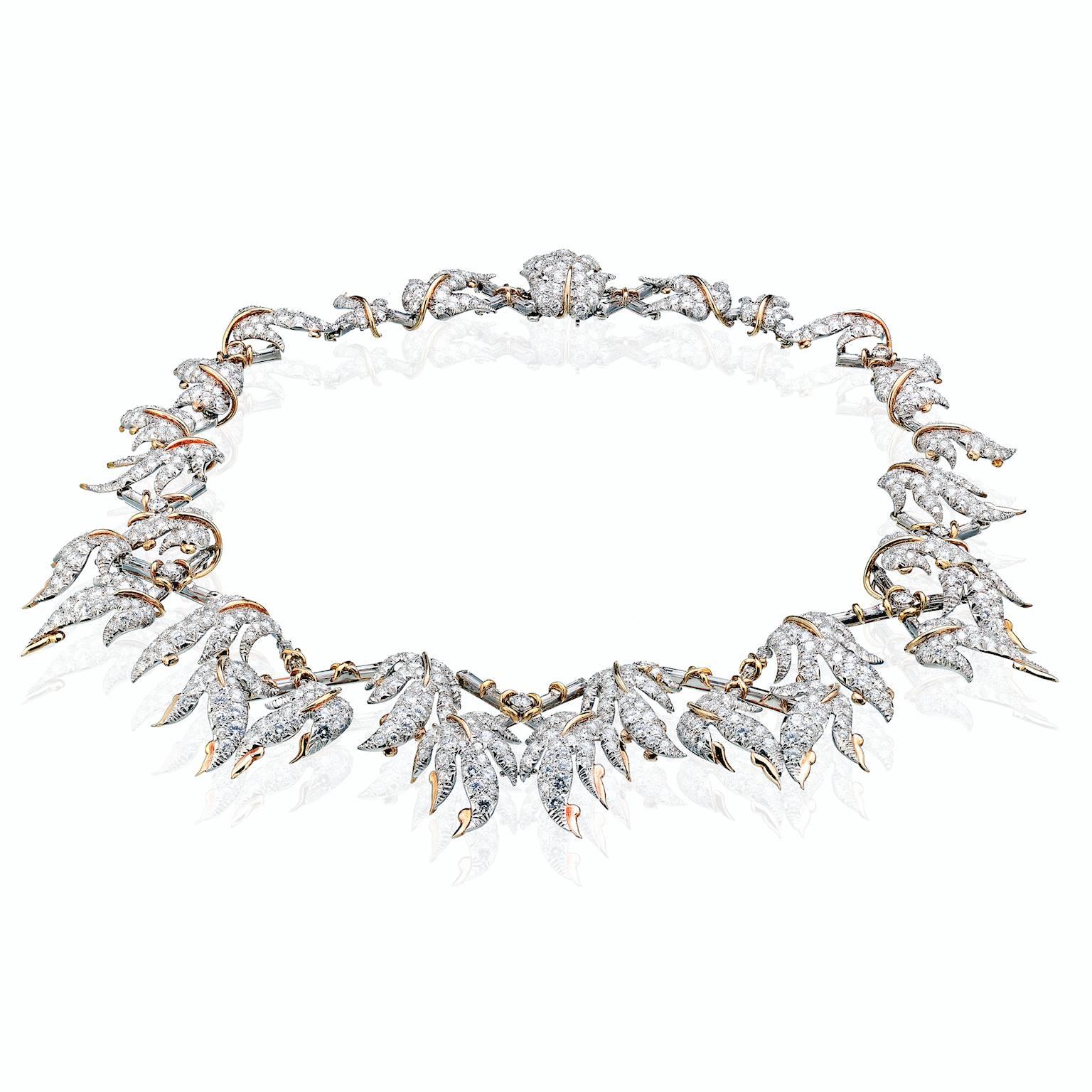 Tiffany France Schlumberger Platinum and 18K Gold Foliate Vine Necklace with Aprop. 46.25 carats Round Brilliant and Emerald Cut Diamonds.
Marked "Tiffany SchlumbergerMade in France.