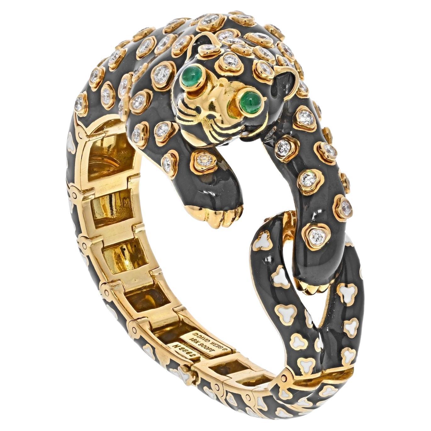 This is a very special animal from David Webb's Animal Kingdom collection: black enamel Leopard bracelet made with yellow gold, platinum, diamonds, emeralds, and black and white enamel. This cute leopard will become your favorite bracelet in your