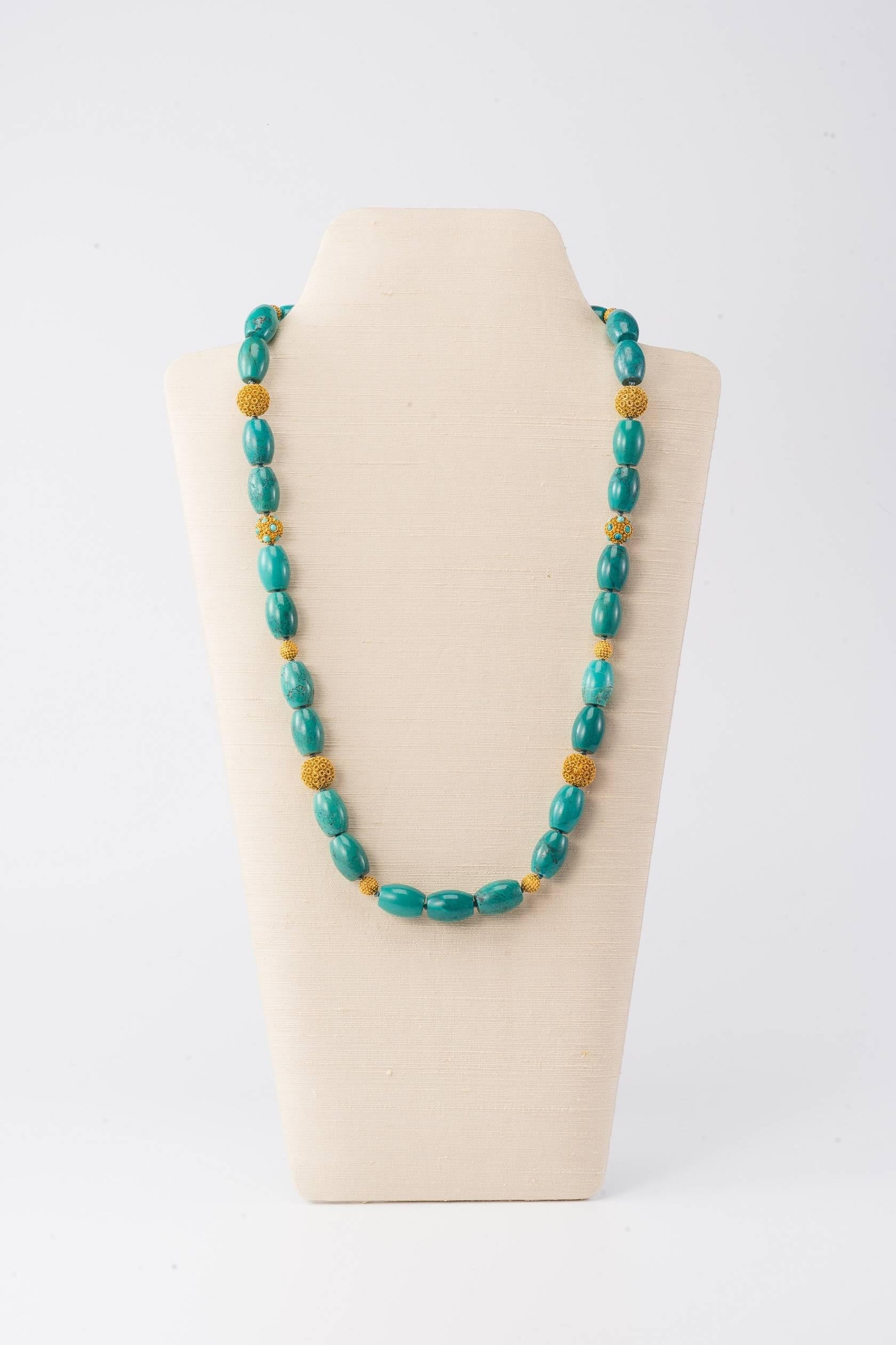 28.5 in L (72cm L) necklace with Tibetan turquoise, vermeil beads &18K gold clasp, in Chinoiserie design

Beautifully coloured turquoise barrel-form beads are offset by the delicate filigree work on the hand-worked vermeil beads.
