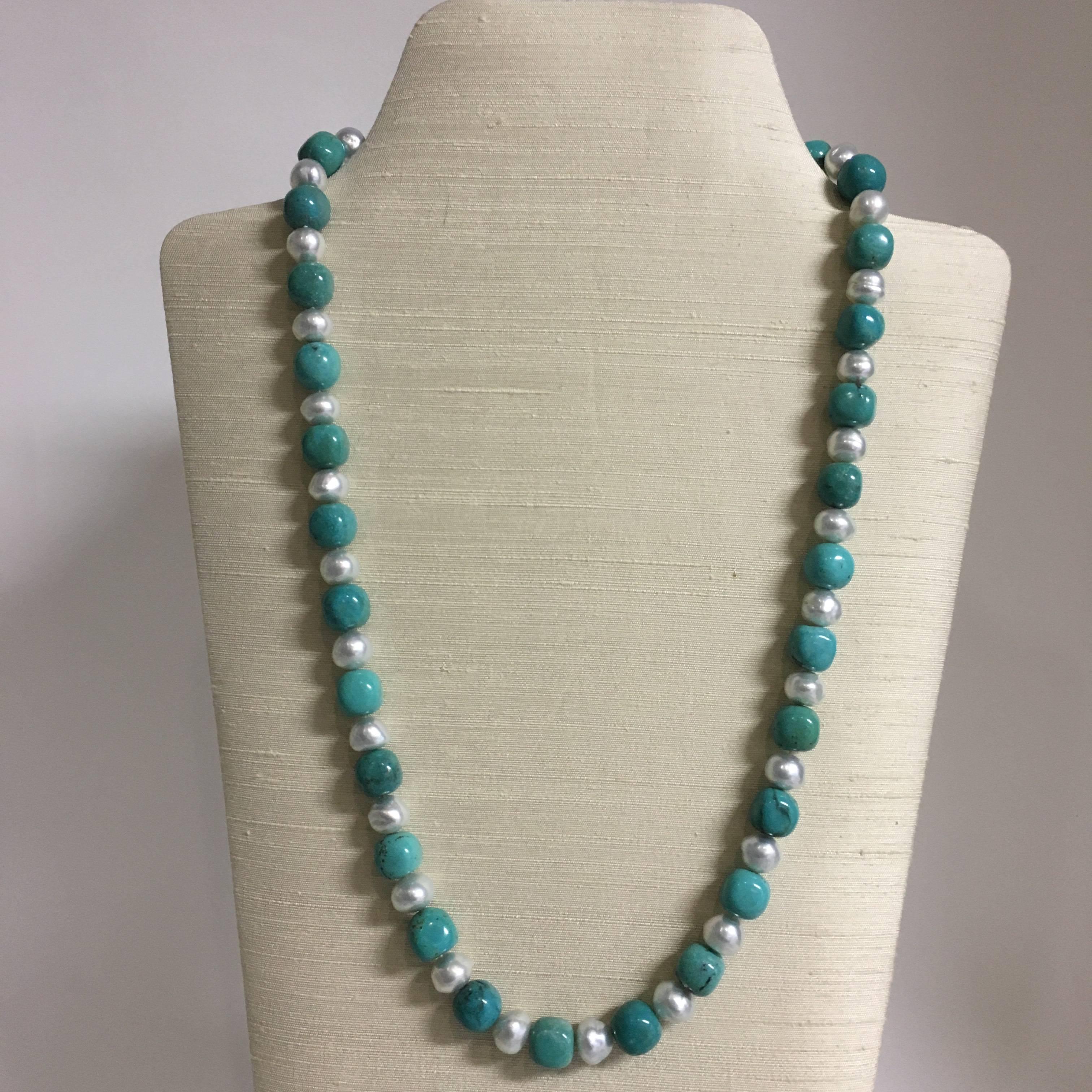 The beautiful 28”L (71cmL) necklace with slightly squarish round Tibetan turquoise beads alternating with luscious South Sea pearls and 18K gold clasp hangs comfortably and elegantly when worn.  