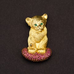 18 Carat Yellow Gold Lion Cub Brooch or Pendant with a Cushion of Rubies