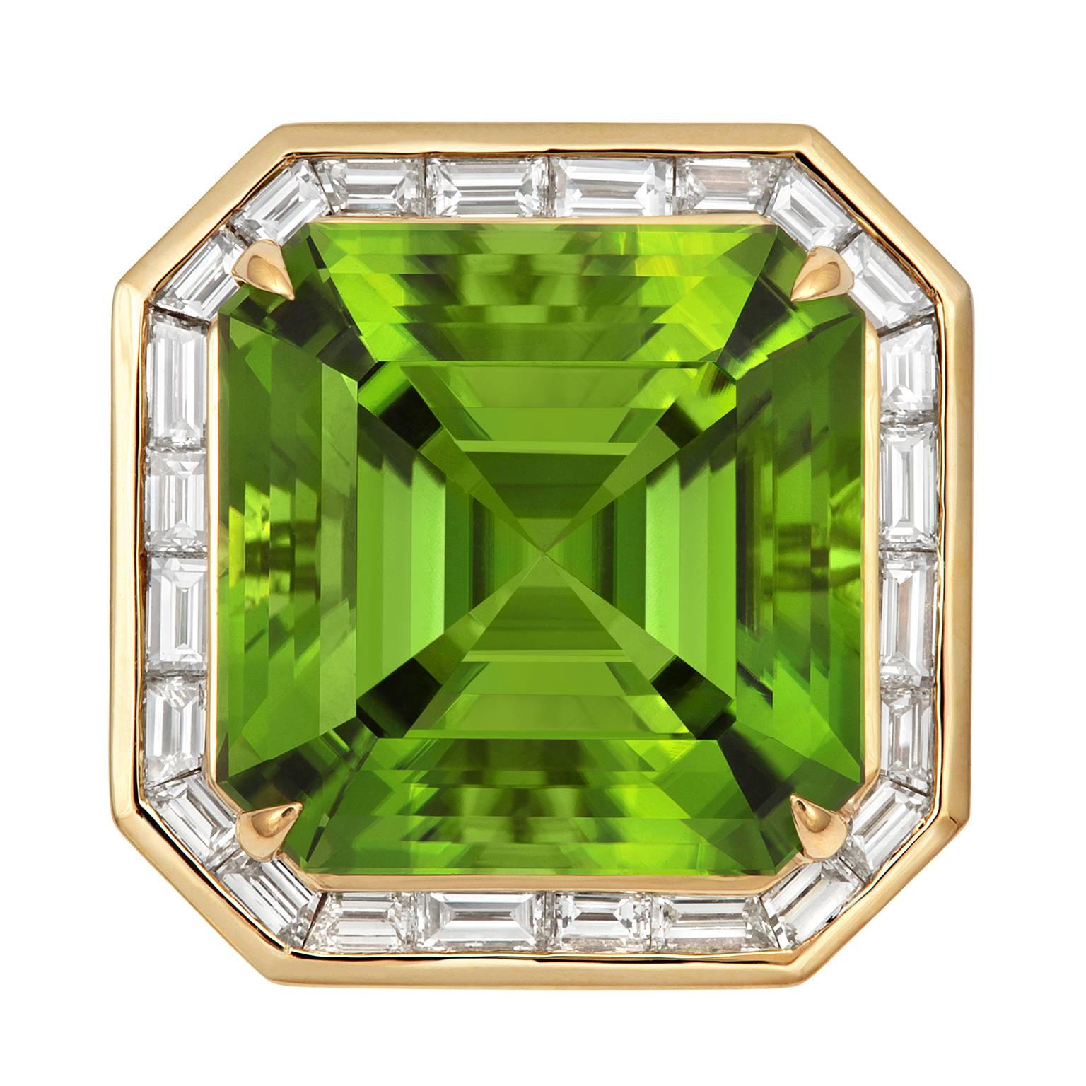 PURE PERIDOT! 

This magnificent  gala ring has been crafted in 18ct Yellow Gold and set with a halo of glittering fine baguette diamonds (1.48ct  G-VS) & an awesome radiant-cut 22.37ct Afghan Peridot. 

One-off & Exclusive!