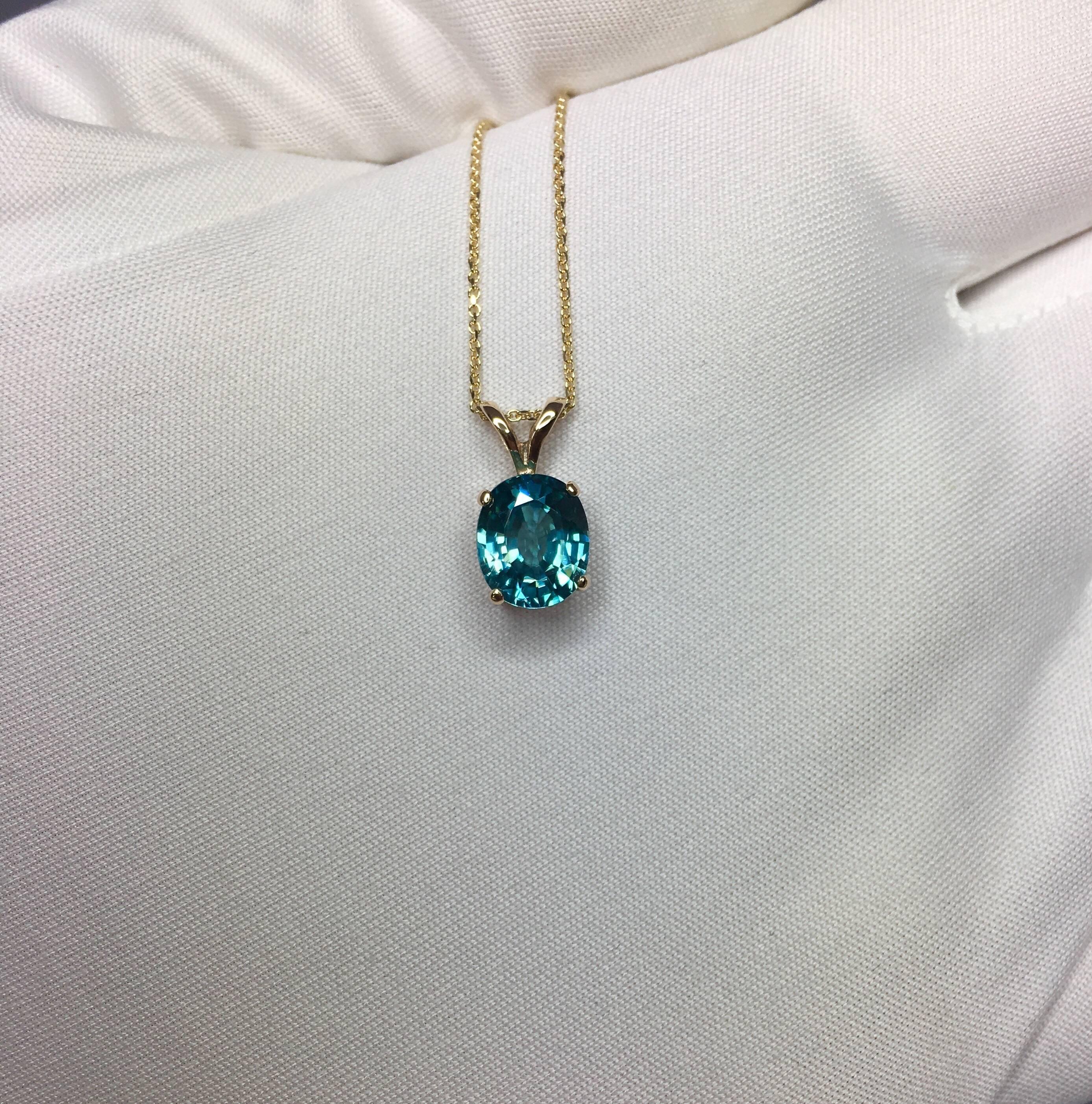 Beautiful natural 2.50 carat blue zircon.
Set in a fine 14k yellow gold solitaire pendant.

Stunning blue zircon with a vivid neon blue colour and excellent clarity, practically flawless.

It also has an excellent oval cut which shows lots of